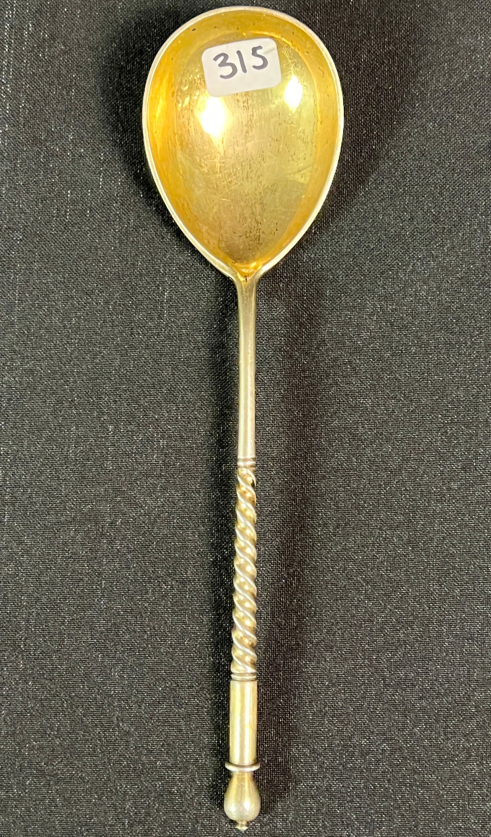 Gilt Silver Niello Spoon with Engraving of the Kremlin: A gilt silver niello spoon with an intricate engraving of the Kremlin. This spoon contains makers marks and is date 1896. Spoon is marked 84, is .875 silver. The total weight is 65.8g and measures