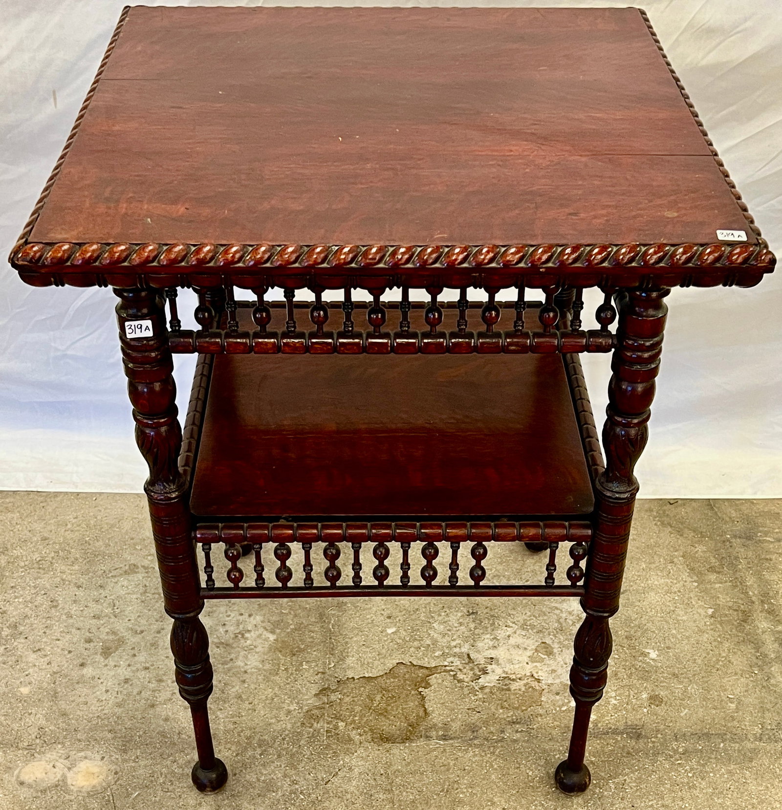 Stick & Ball Occasional Table, c.1870s/80s: An Aesthetic Movement stick & ball occasional table in cherry stained oak, c.1870s/80s. It features turned and carved acanthus legs, ball feet, and a bread crust edge on the top. With minor damage (mi