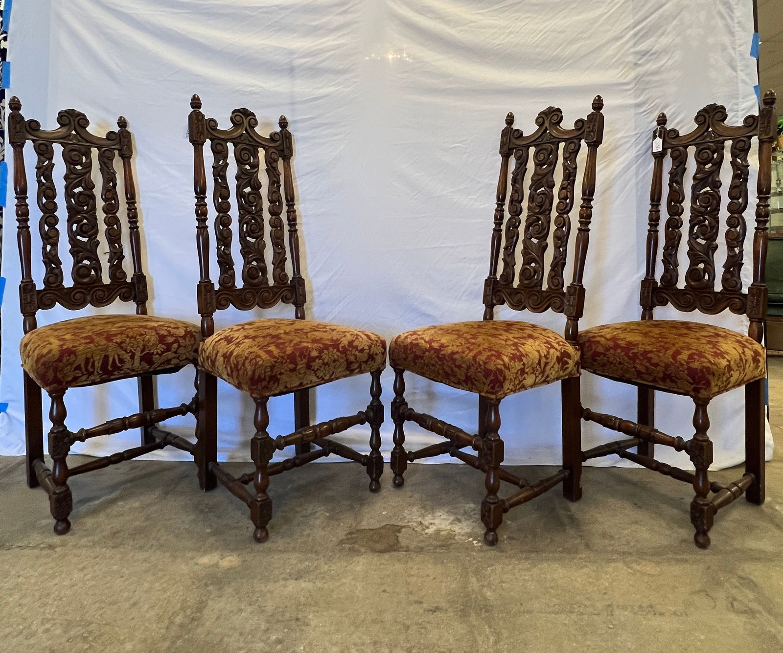 4 Black Forest Dining Chairs: 4 tall-back Black Forest style mahogany dining chairs with pierced scroll-work decorations, floral accents, in original finish and newly reupholstered. These wonderful German dining chairs make a
