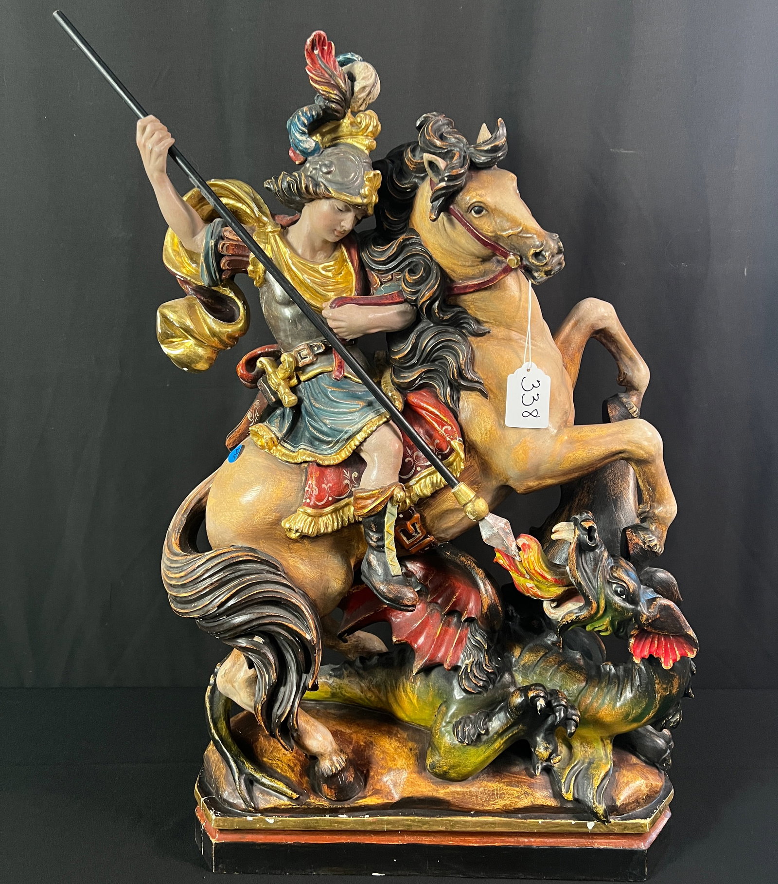 German Large Wood Carving of St. George- Oberammergau: A wonderful hand carved wood and polychromed statue of St. George slaying the dragon. This large and impressive statue is German and is hand carved in the village of Oberammergau, which has been