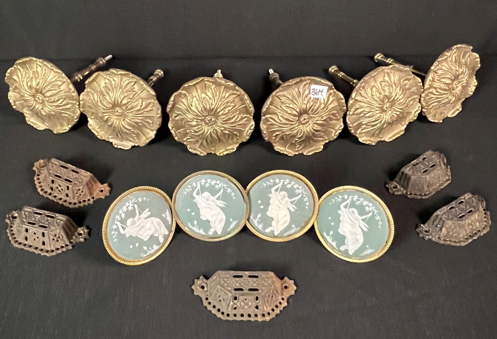 Group of Victorian Curtain Tiebacks and Hardware: A group of 6 solid brass Victorian tiebacks, along with 4 Wedgwood tiebacks, and a set of Victorian dresser pull hardware. These items came from the G. Heilman Estate in Lacrosse WI that came out of