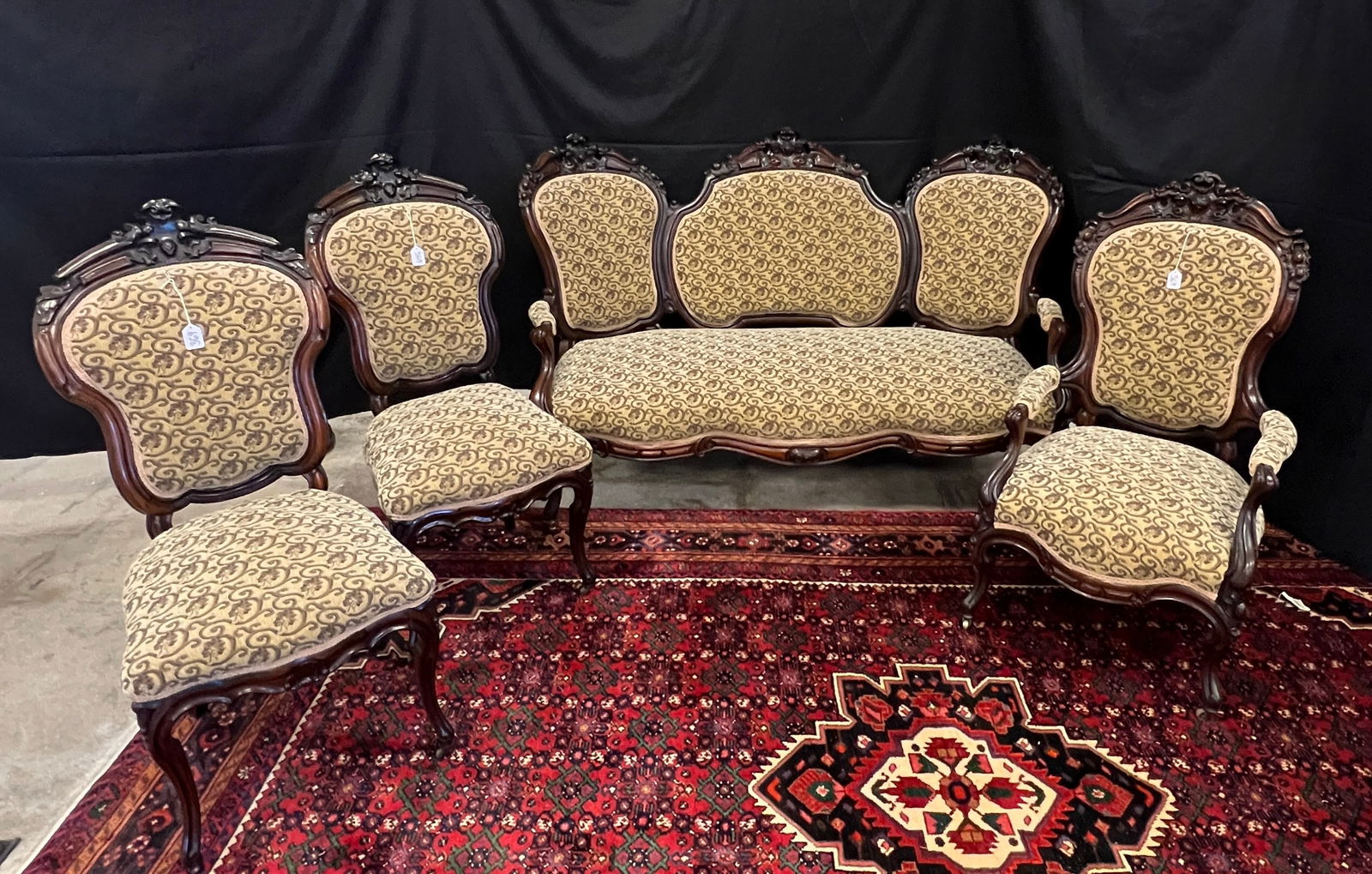Rosewood Belter or Meeks Parlor Set: A solid rosewood parlor set, attributed to Belter or Meeks. It is leaf and scroll pierced carved, all in original finish, newly upholstered, consisting of a 3 section sofa with cabriole legs, 2 lady