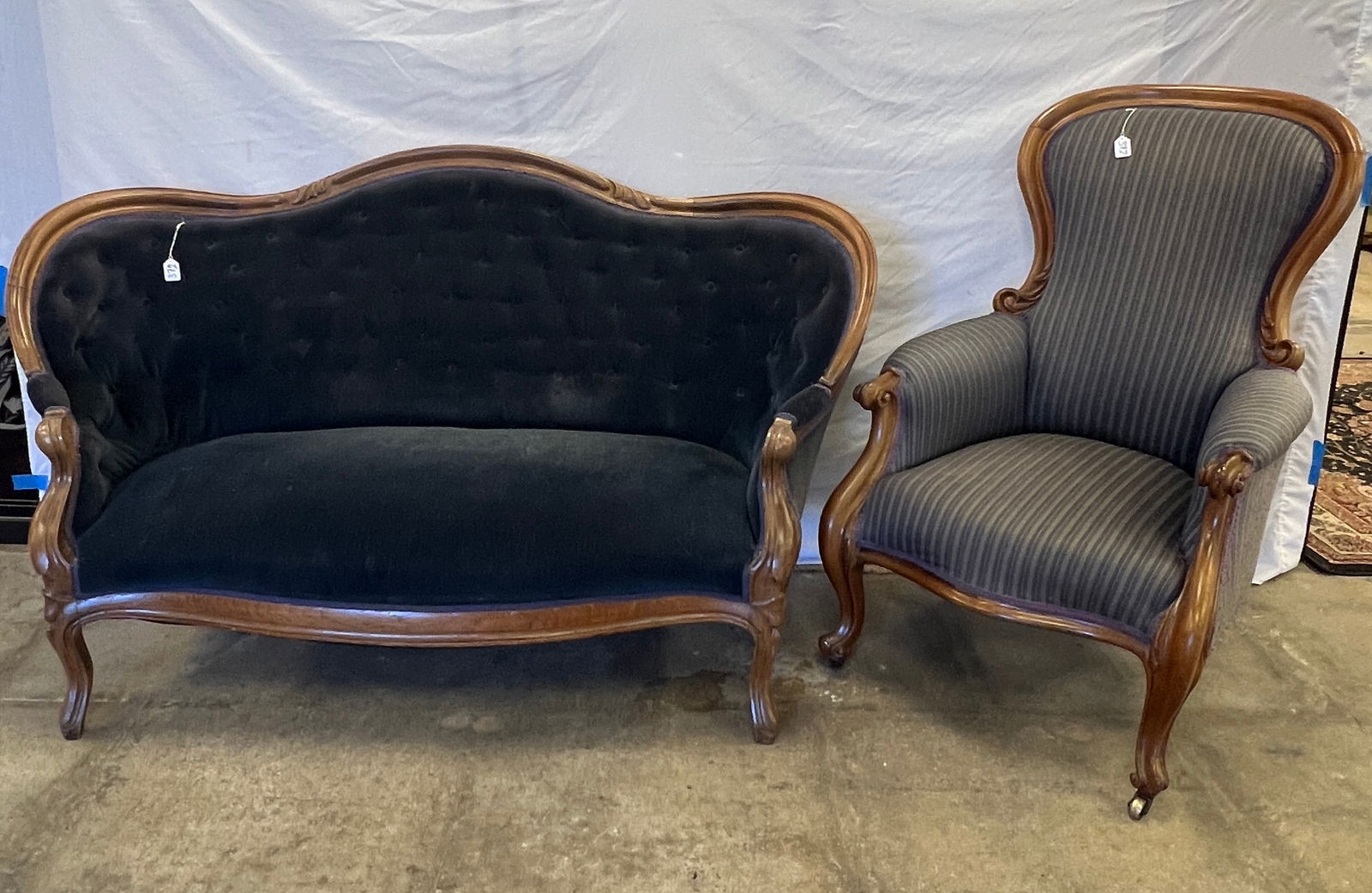 Walnut Victorian Sofa and Gentleman's Chair: A 2 piece 1850s/60s heavy walnut Victorian parlor set with serpentine backs and acanthus leaf carvings, cabriole legs and the frames are in excellent condition. The sofa is mohair blue and button