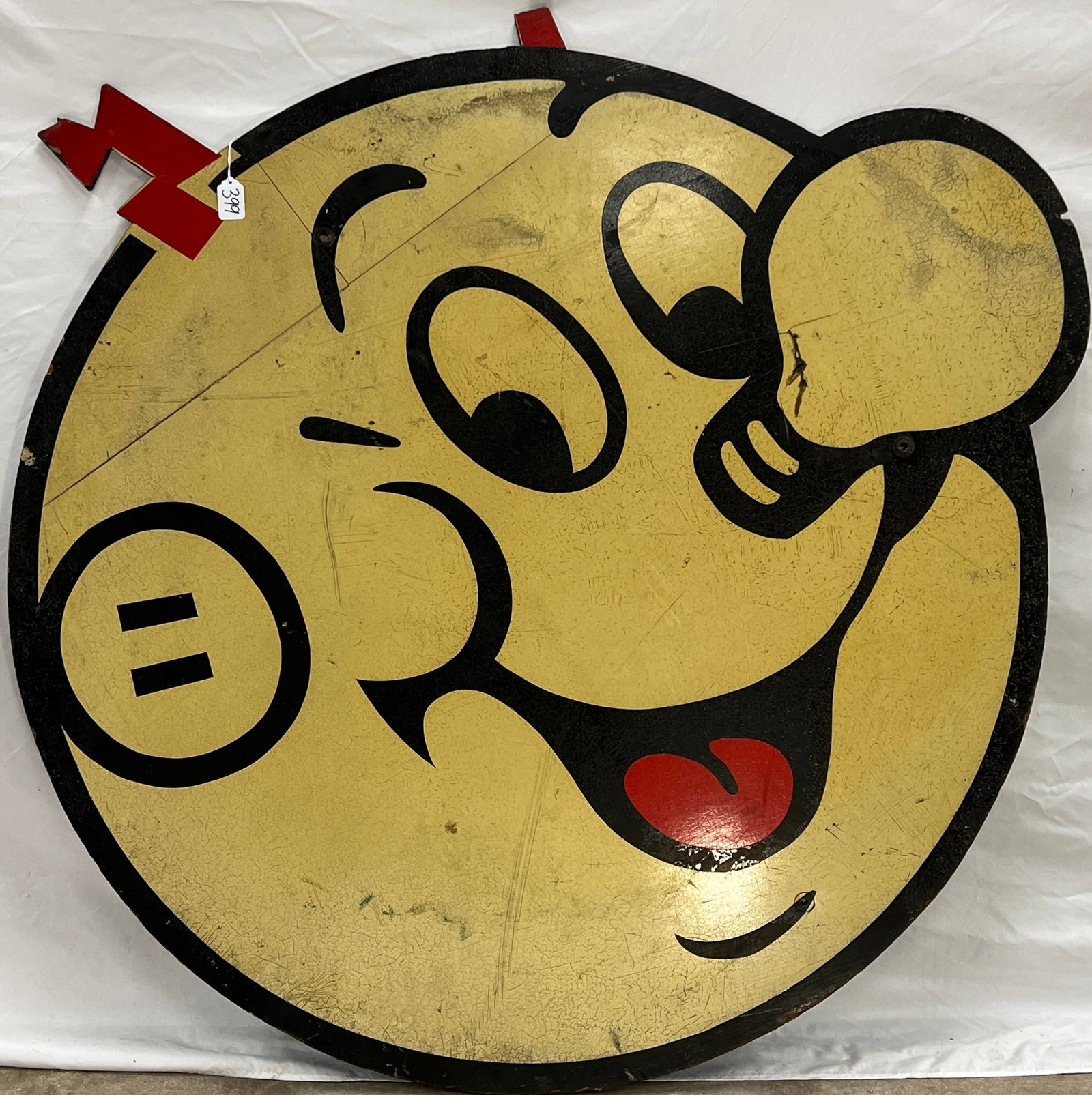 Large Wooden GE Advertising Sign: A large, round wooden GE advertising sign. It appears that the lightning bolts are missing/broken off. This impressive vintage sign features Reddy Kilowatt, a famous character licensed by power compan