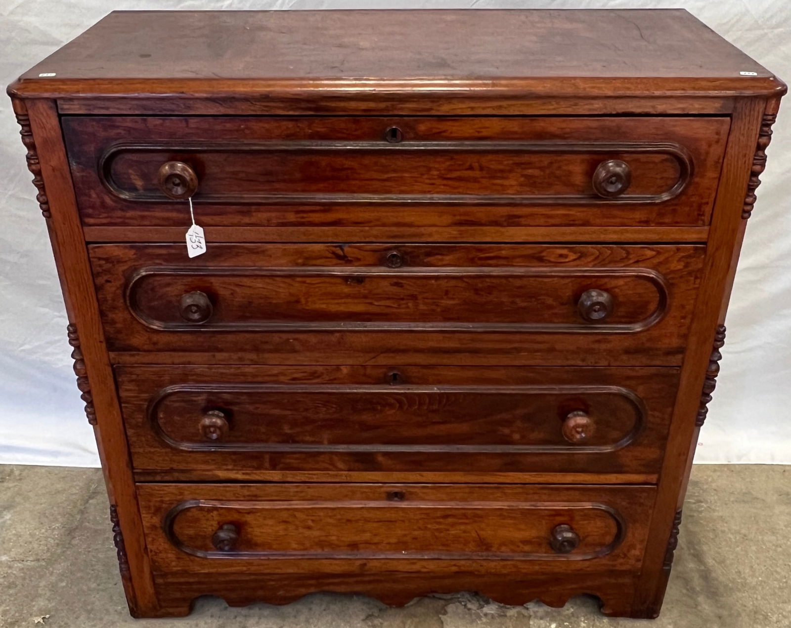 Dresser with Racetrack: A walnut Victorian racetrack dresser with original turned wood pulls, scalloped edge base and appears to be in original finish. In as found condition, this measure 38" tall X 38" across X 18" deep.