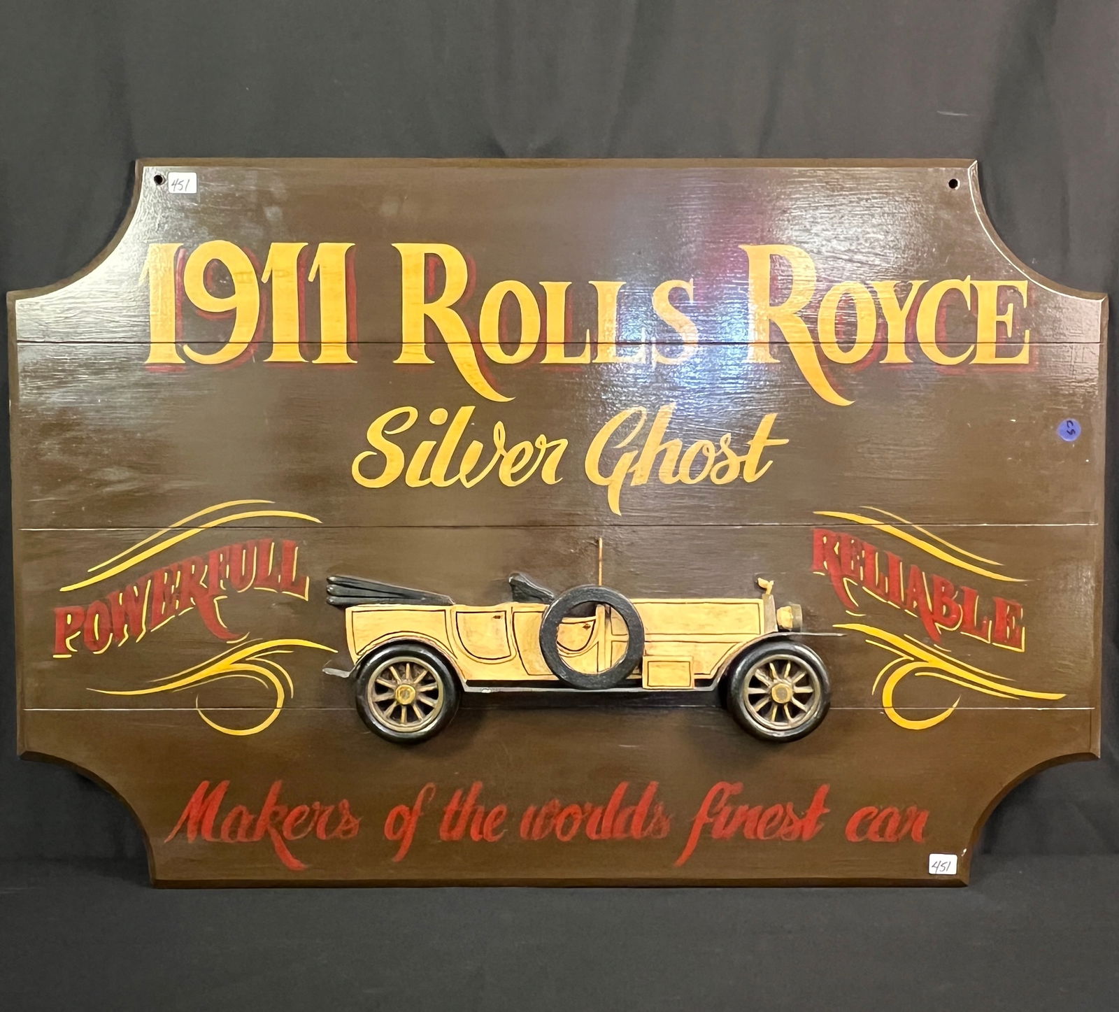 Rolls Royce "Silver Ghost" Handmade Wooden Sign: A vintage custom handmade sign for a 1911 Rolls Royce Silver Ghost car. The car is 3 dimensional and hand carved, sign reads "Reliable Powerful Makers of the World's Finest Car". 25" X 36".