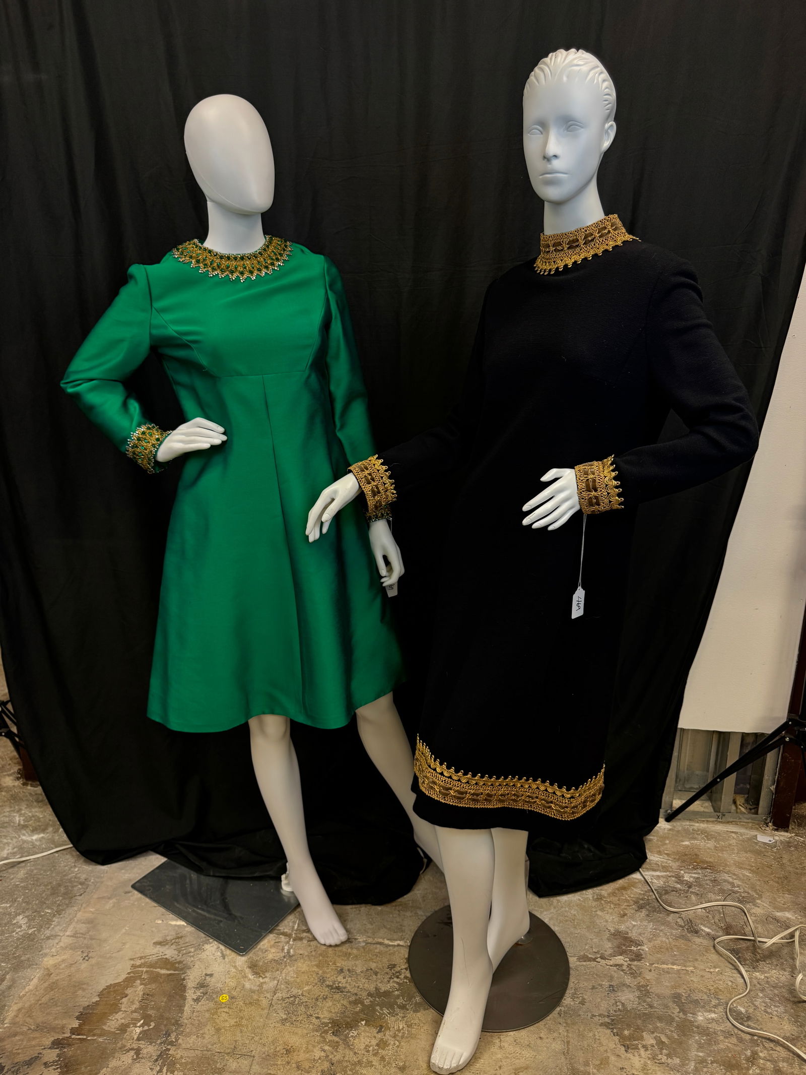 2 Vintage 1960's Jeweled Cocktail Dresses: 2 Vintage holiday themed jeweled long sleeve cocktail dresses c.1960's to include a knee length emerald green silk Marshall Field's dress with side pockets, empire cut, that features beading,