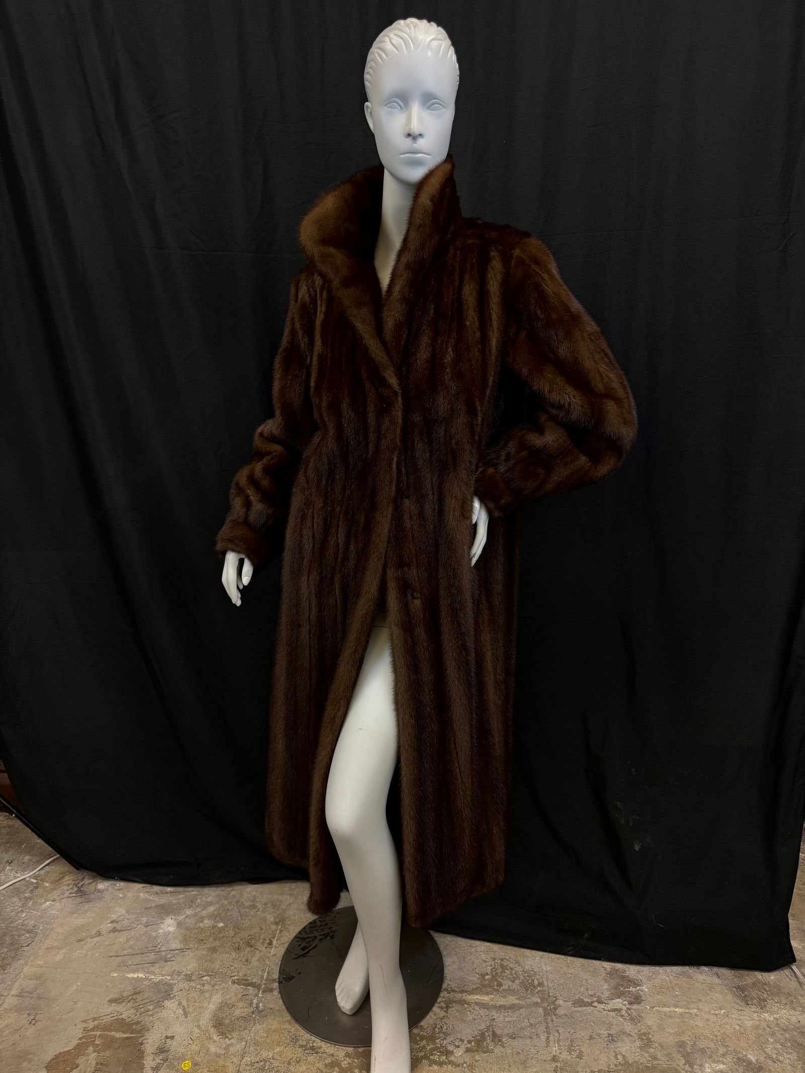 Female Demi Buff Mink Coat: A 3/4 length demi buff female mink coat with gathered sleeves and hook and eye closure, and side pockets, professionally stored in excellent condition.