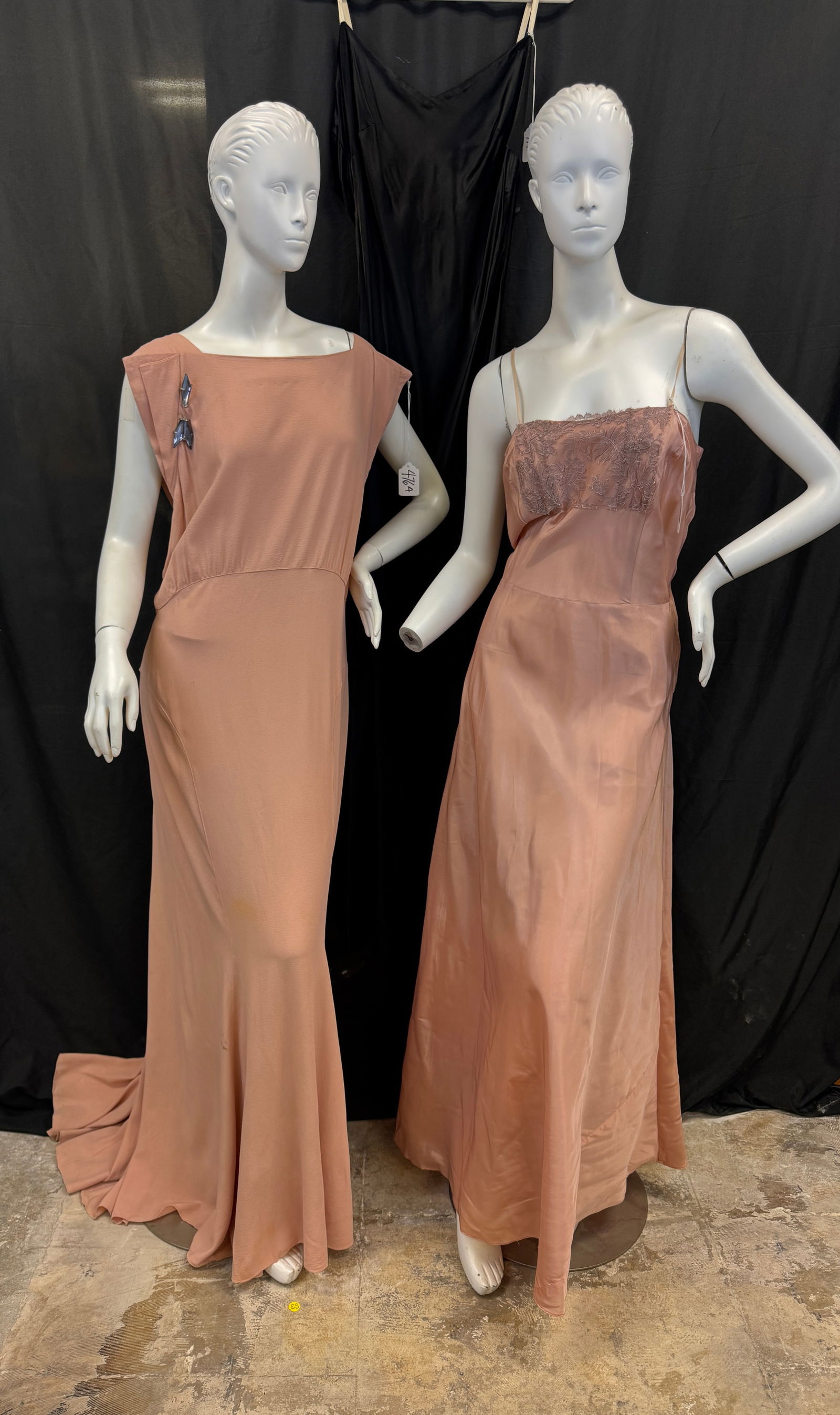 1920's Vintage Peach Crepe Evening Gown, More!: A group of vintage dresses and slips to include a late 1920's backless crepe bias cut evening gown with an Art Deco blue rhinestone arrow pin detail (stain on skirting noted), a 1930's black satin bia