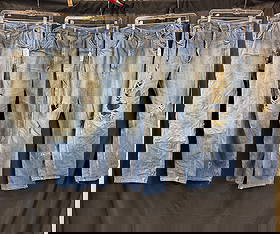 Group of Vintage Denim c.1940/50's, Powerhouse, Carters: A group of men's distressed denim to include a pair of 1940's Carters farm jeans with patched front legs waist 34, a pair of Carters blue jeans with patch back pockets and interesting wear patterns wa