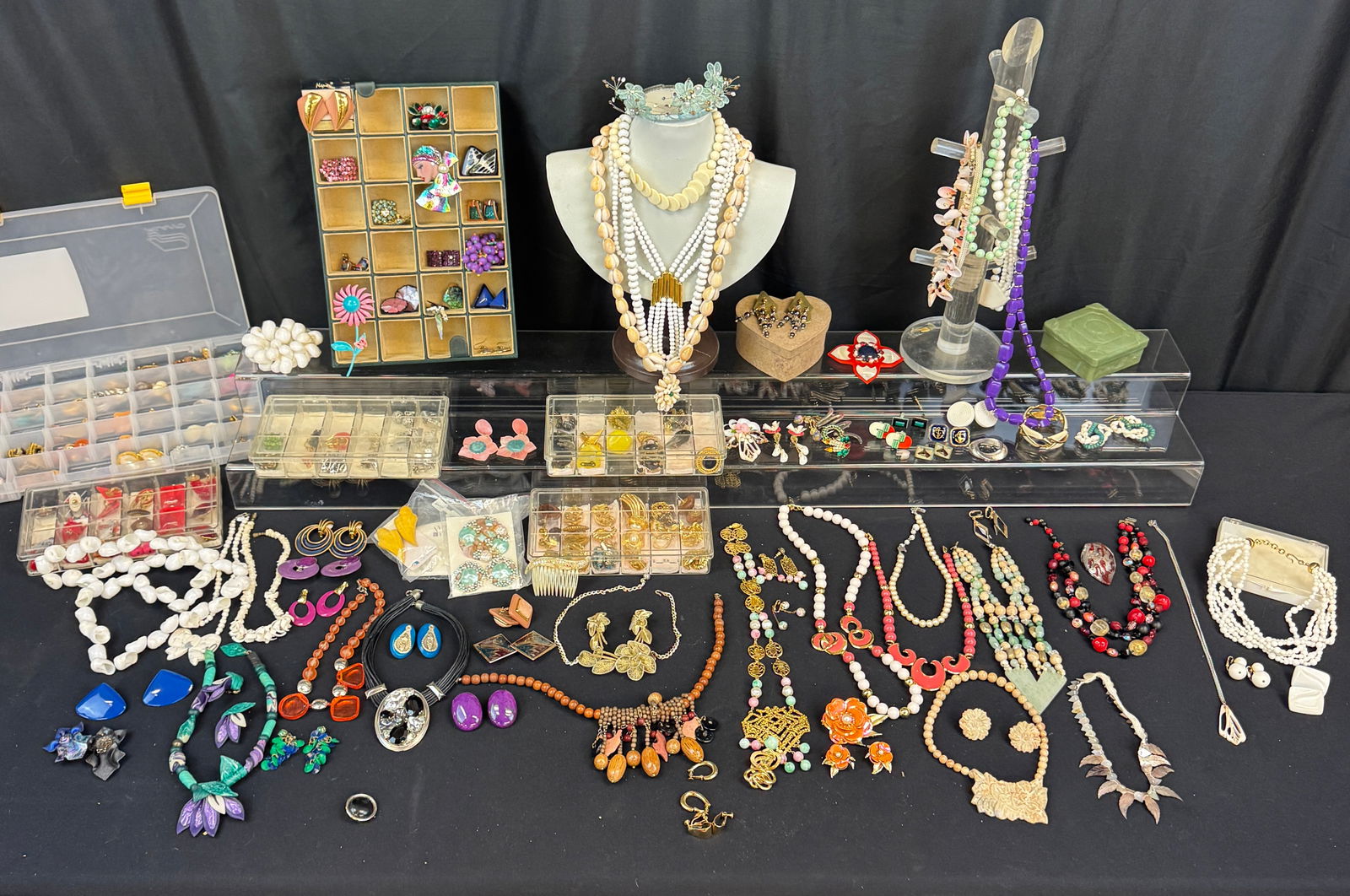 Huge Group of Vintage Jewelry: A huge group of vintage jewelry c1940-1980's to include beaded necklaces clip earrings, necklaces, rhinestone earrings and necklaces, brooches, pins and much more!