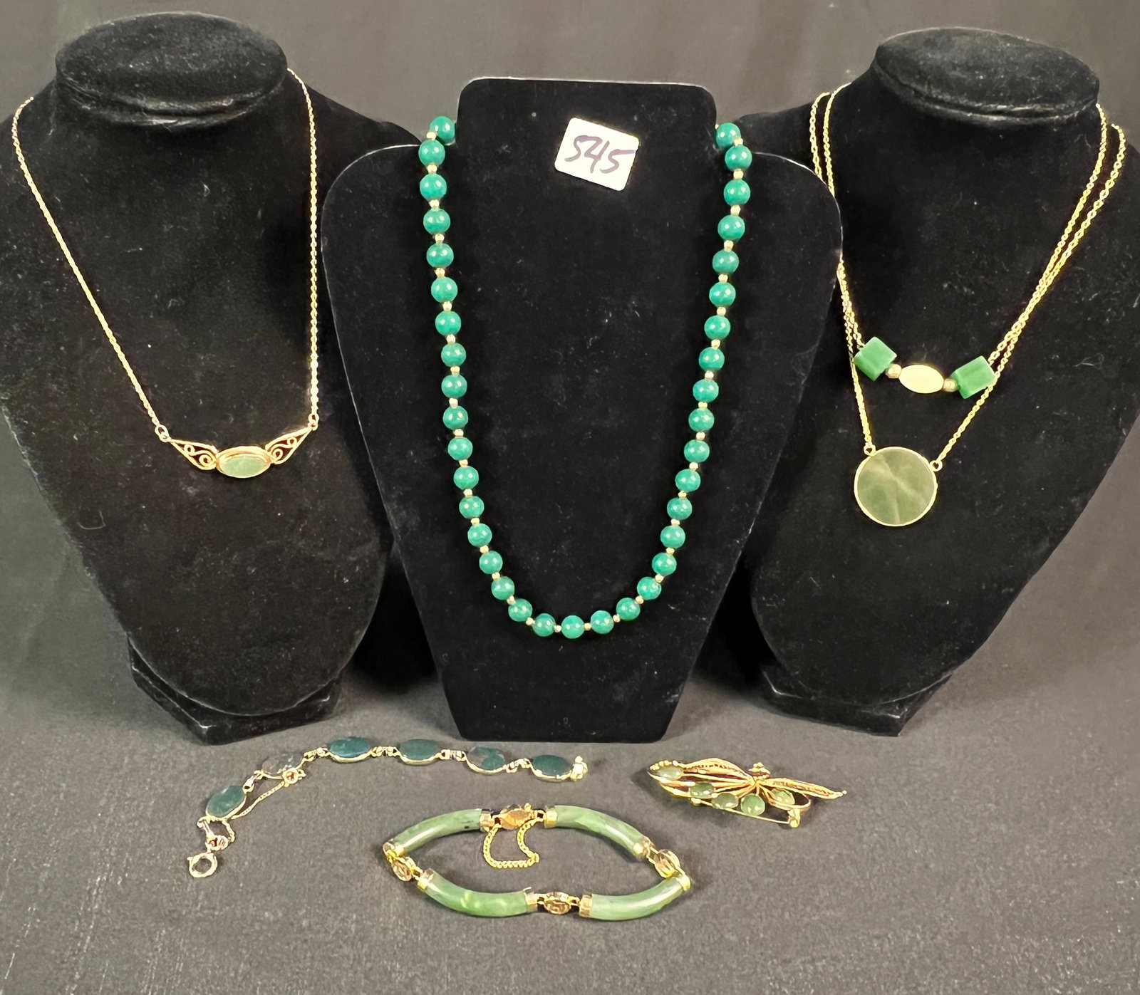 Vintage Jade Necklaces Bracelets and Pins c1960's: A group of vintage 1960's jade jewelry to include necklaces, bracelets, and a floral brooch, all in excellent condition.