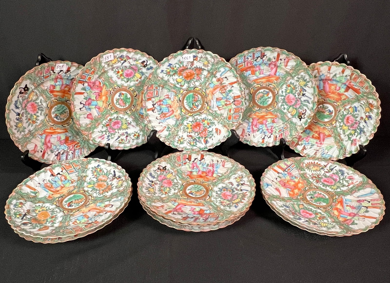 Group of Chinese Export Rose Medallion Dinner Plates: A group of 12 Chinese export Rose Medallion dinner plates with a scalloped ridged edge. These exquisite Rose Medallion porcelain plates, dating to the mid-to-late 19th century (c. 1850–1880), are ch