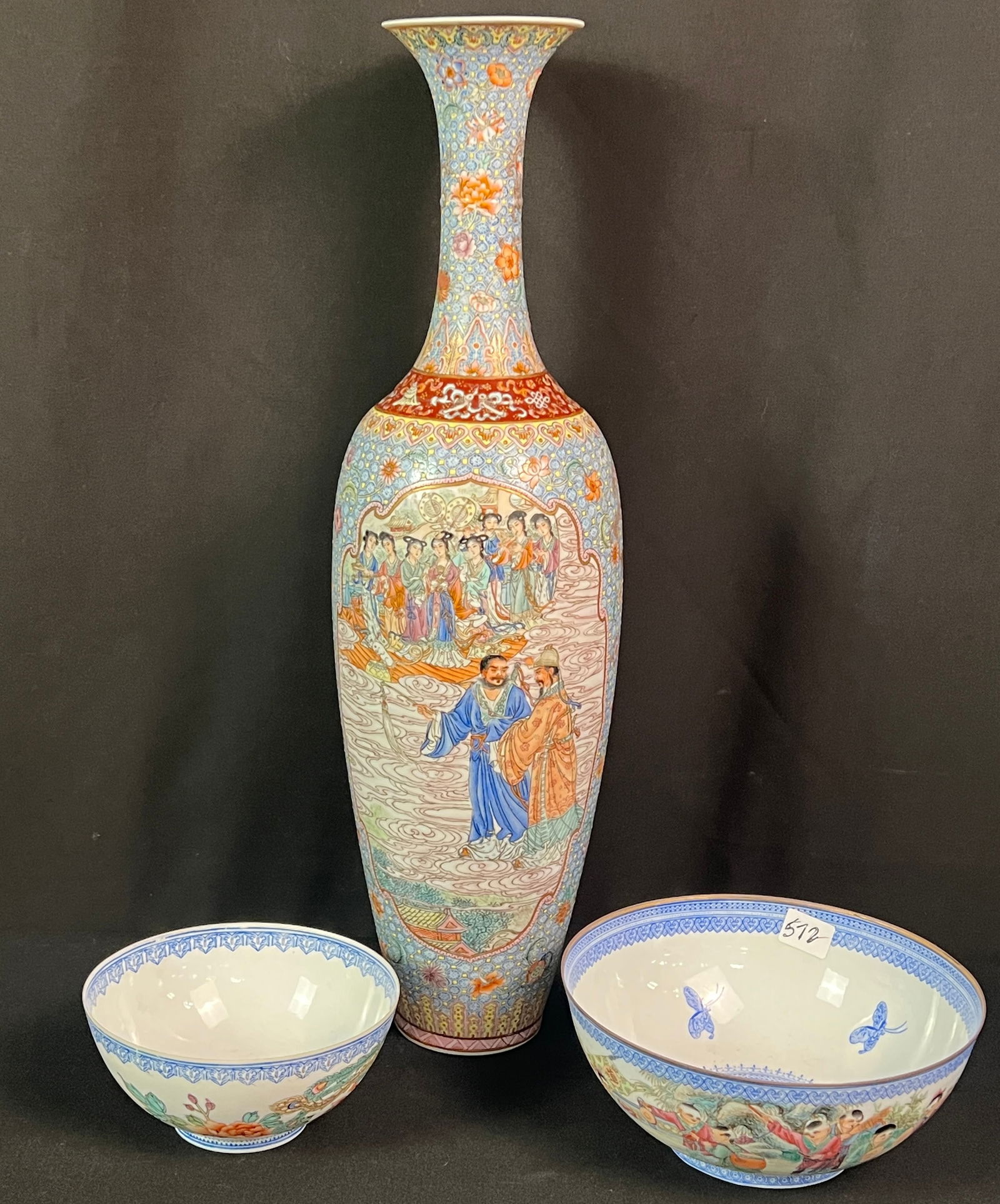 Chinese Egg Shell Hand-Painted Vase and Two Bowls: A wonderfully detailed egg shell vase depicting a group of courtesans in a garden and the king (17.5" tall). One bowl depicts musicians (3" tall X 7" across) and the other bowl depicts a bird of parad