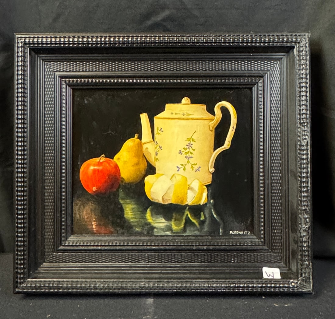 Patrick Lodwitz Hyperrrealist Oil on Board: This quality framed Hyper-realist oil on board still life is by listed French artist Patrick Lodwitz (1953- ). It depictrs fruit and a teapot on a black background and is signed in the lower right cor