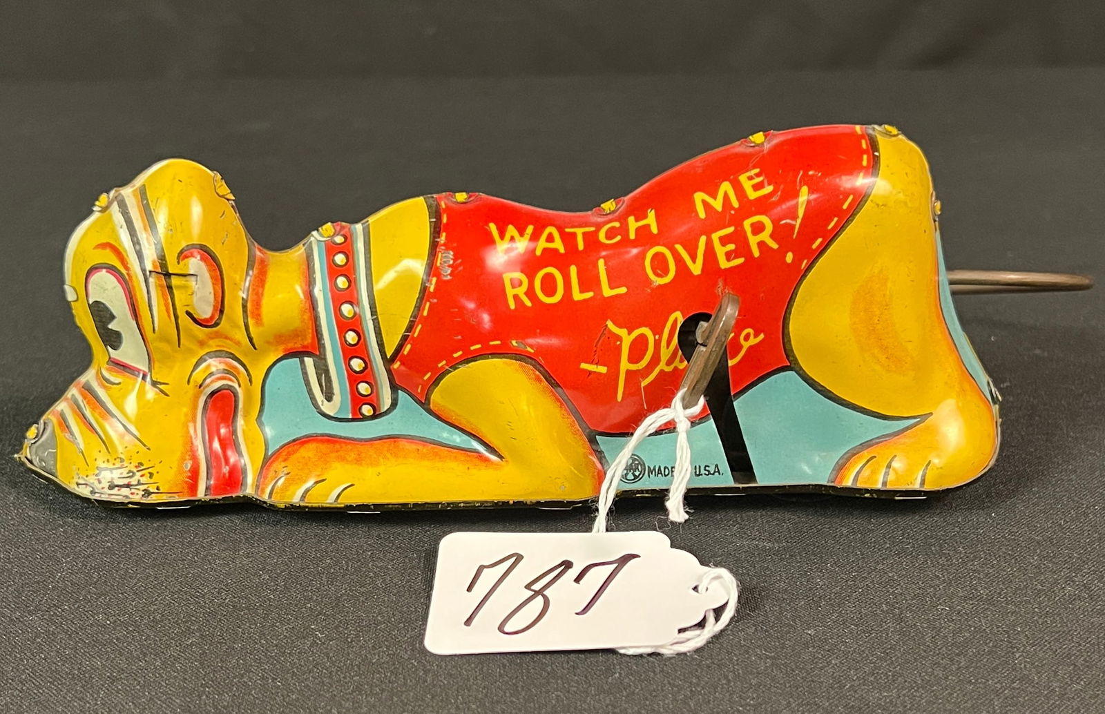 Walt Disney Tin Lithograph Key Wind Pluto: A brightly tin lithograph 1939 Walt Disney Pluto rollover toy. In good condition, it measures 3.5" tall X 8" across.