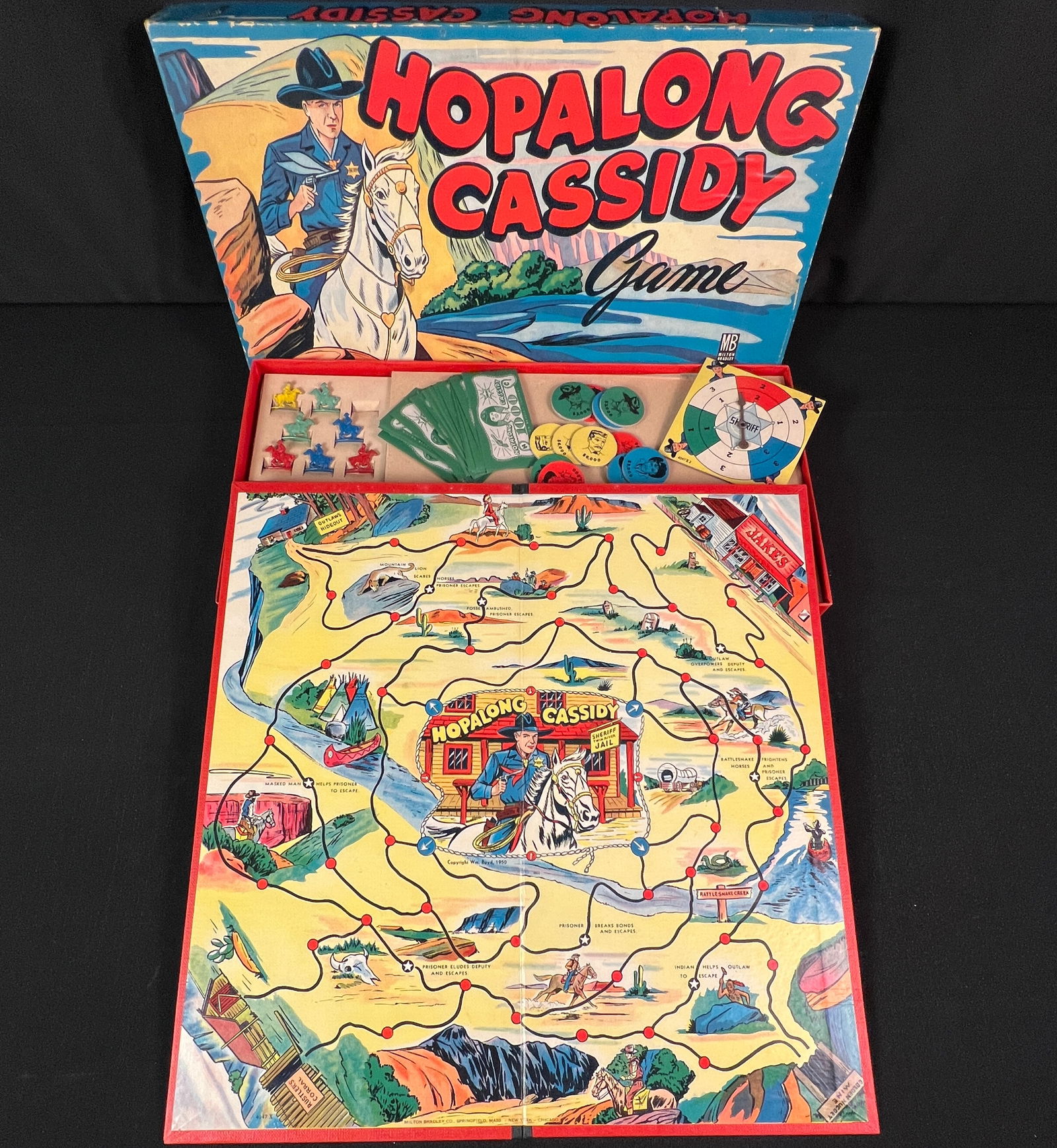 Vintage Board Game: A mint condition Hopalong Cassidy board game from 1950 by Milton Bradley Co., original box, bright graphics, complete condition.