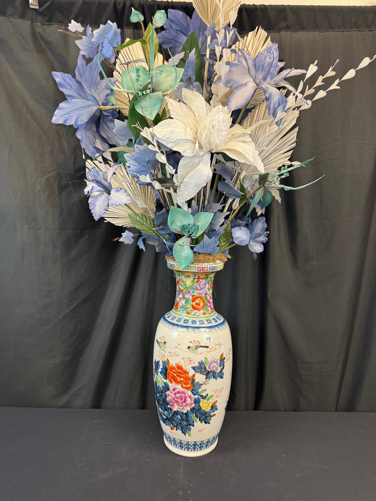 Large Chinese Vase with Bouquet: A large, elaborately hand-painted Chinese porcelain vase with a large attached faux floral bouquet. This vase features floral and bird decoration, including peonies and chrysanthemums, and bands of