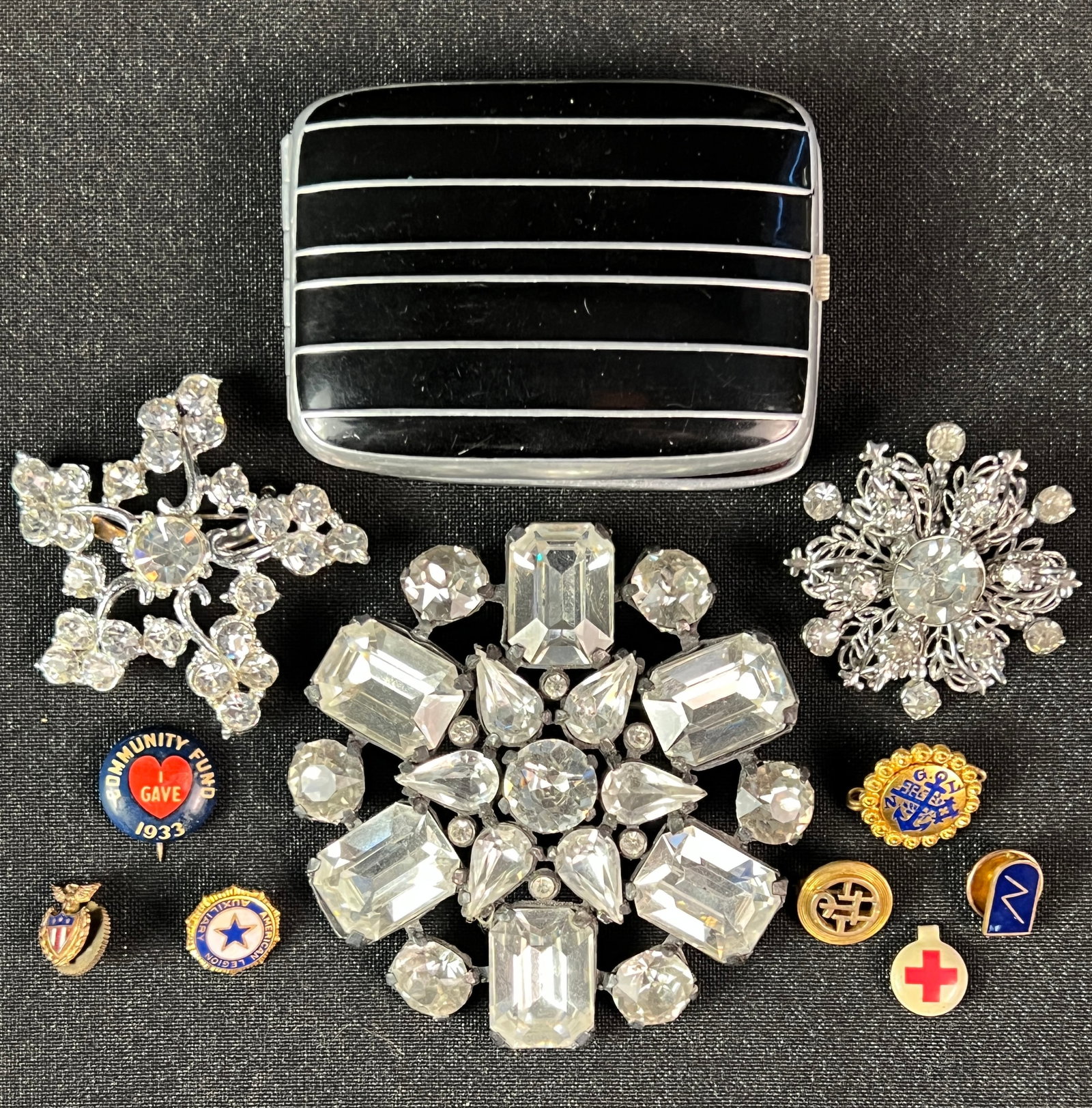 Group of Rhinestone and Costume Jewelry: Group of jewelry to include a large rhinestone brooch, 2 smaller brooches, a collection of small assorted pins and art deco case.