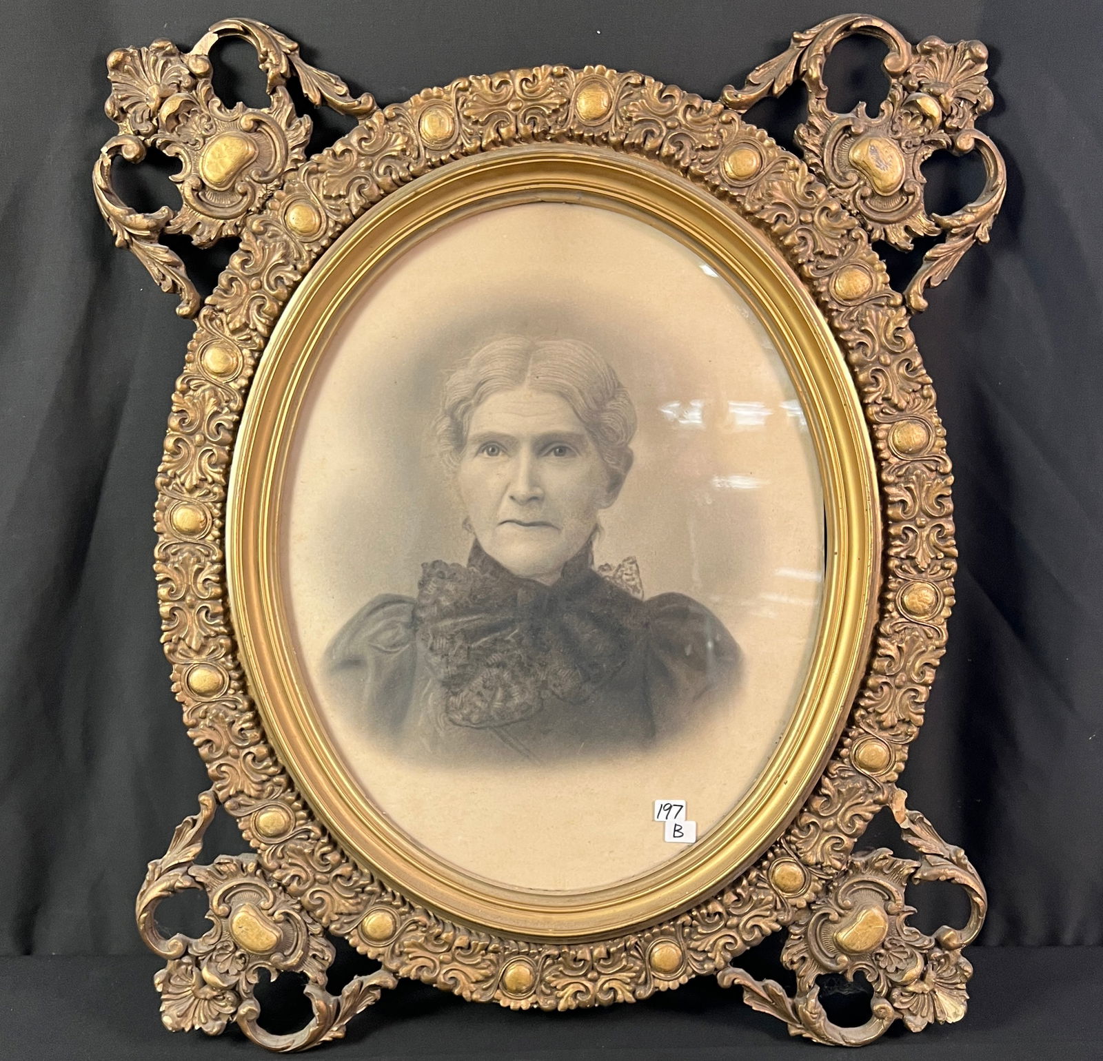 Elaborate Gold Leaf Frame: A Victorian elaborate gold leaf frame in good condition, depicpting a portrait of a young maiden with clarity in her eyes. In good condition with minor losses, it measures 28" tall X 23" across.