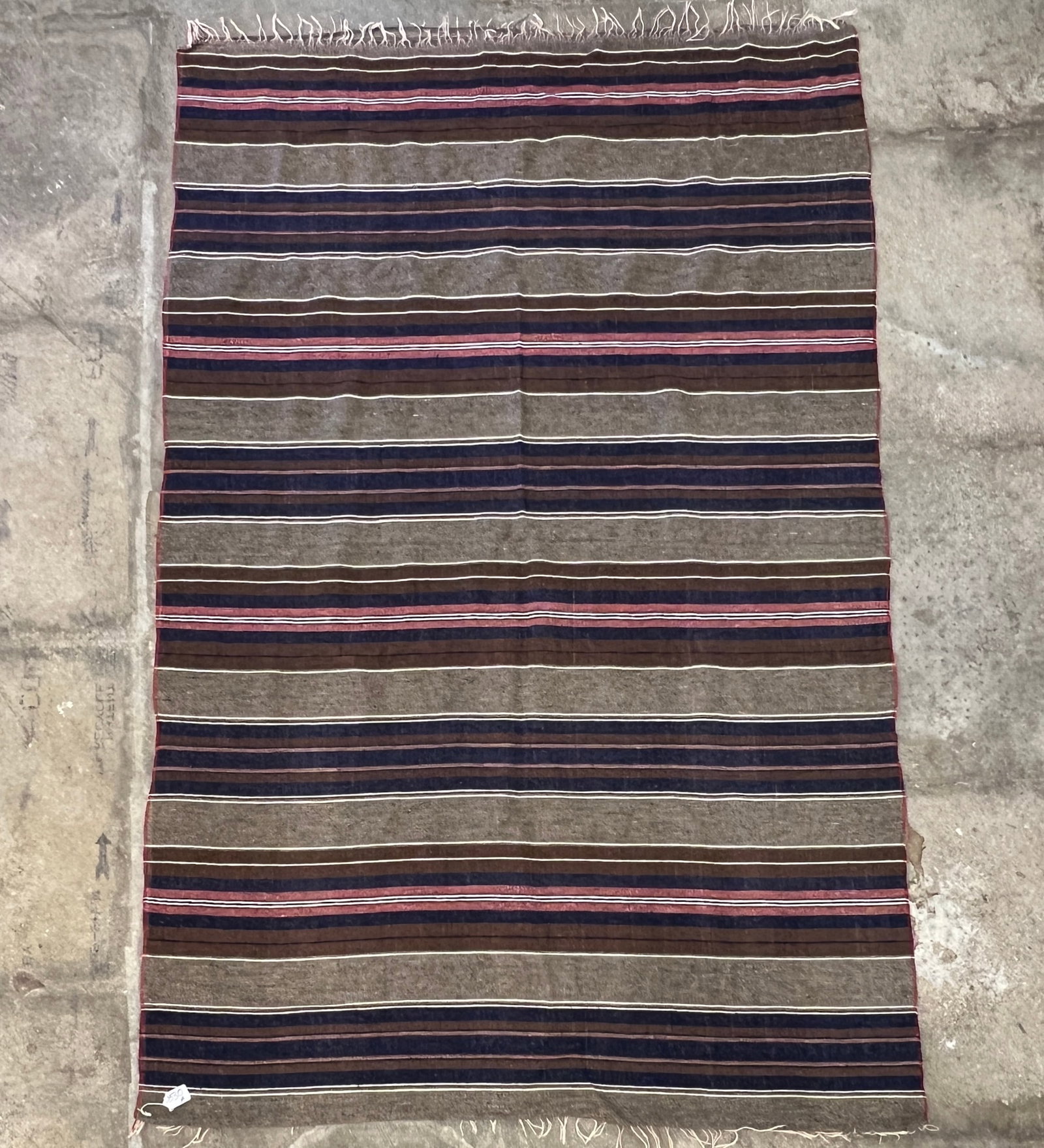 Southwest Indian Blanket: A finely woven Southwest Indian blanket or shall in a stripped pattern of navy, browns, greys, cream and reds. In great condition, it measure 80" long X 52" across.