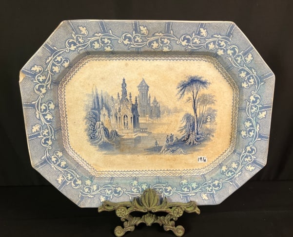 Blue Transferware Platter of Important Size c. 1846: A blue transferware platter of important size, it dates to 1846. The pattern depicted is Rousillon and was made by J Goodwin Longton. It measures 20" across X 15", there is a chip noted and some