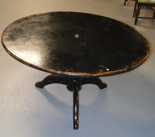 Round turnpost three legged oriental table in black lac: Round turnpost three legged oriental table in black lacquer. Measures 29" tall, 54" diameter.