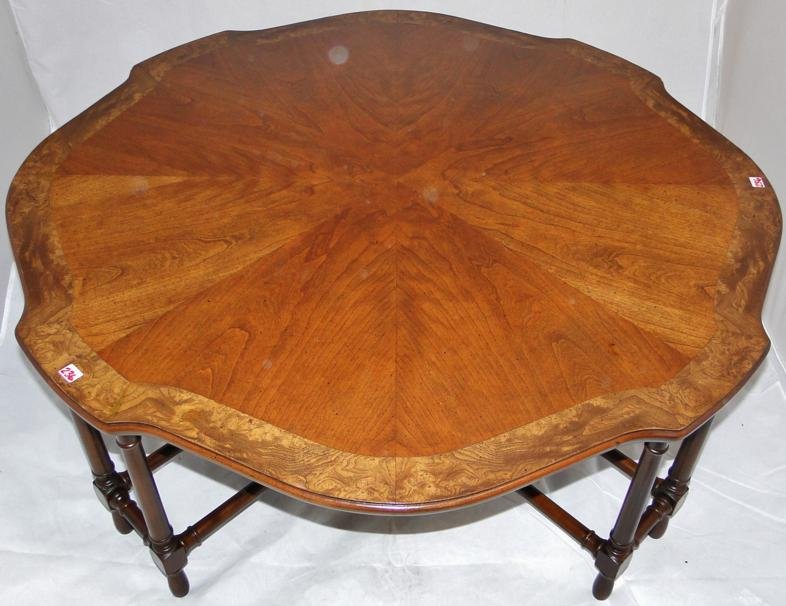 Henredon mahogany serpentine top coffee table with Span: Henredon mahogany serpentine top coffee table with Spanish inlay, 8 turned legs; excellent original finish; 16" tall x 40" across