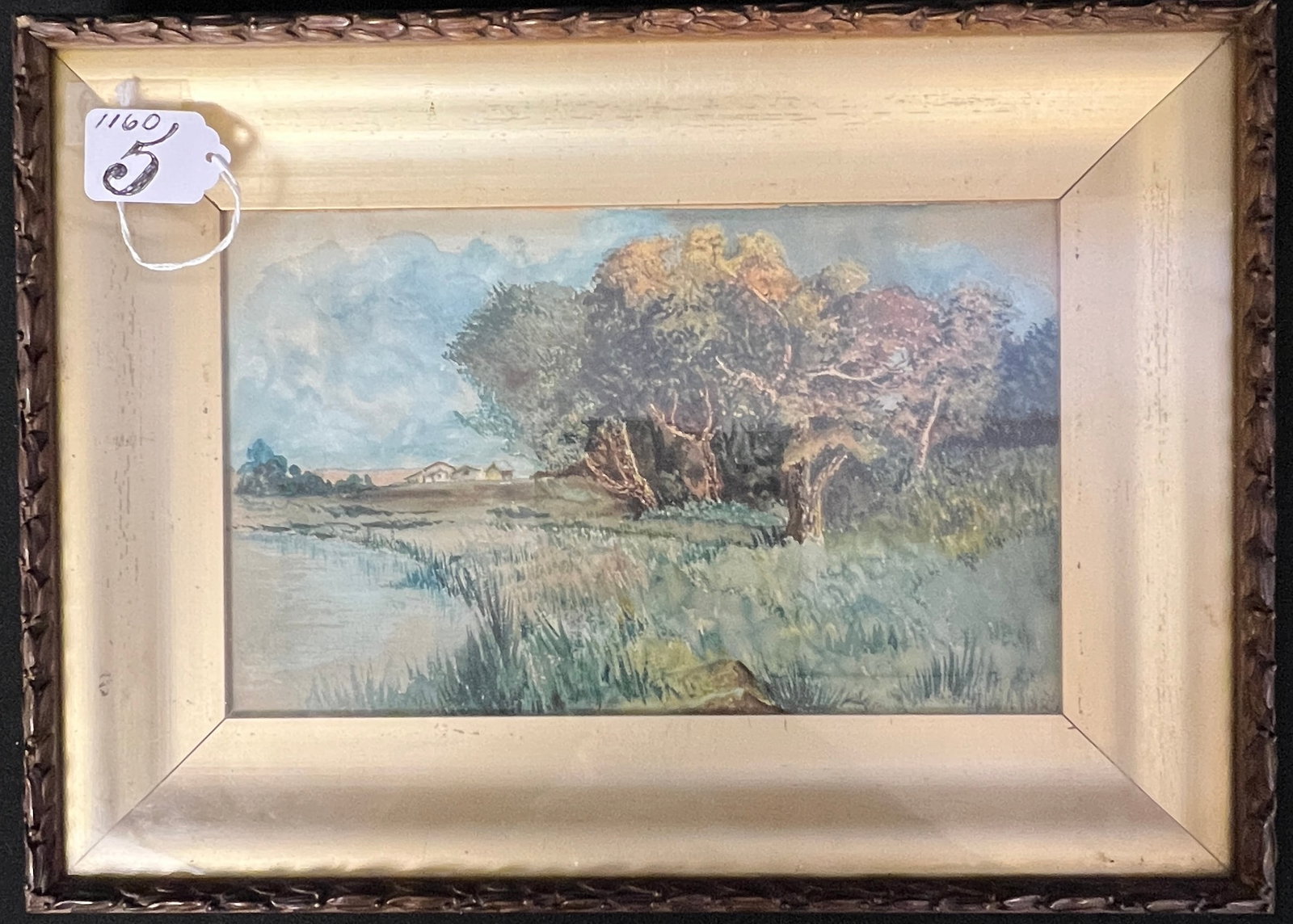 A Watercolor of California River Scene: A California watercolor river scene in a turn of the century shadow box frame, depicting a woodland with houses in the foreground and early cedar trees. In good condition it measures 10.75" tall X