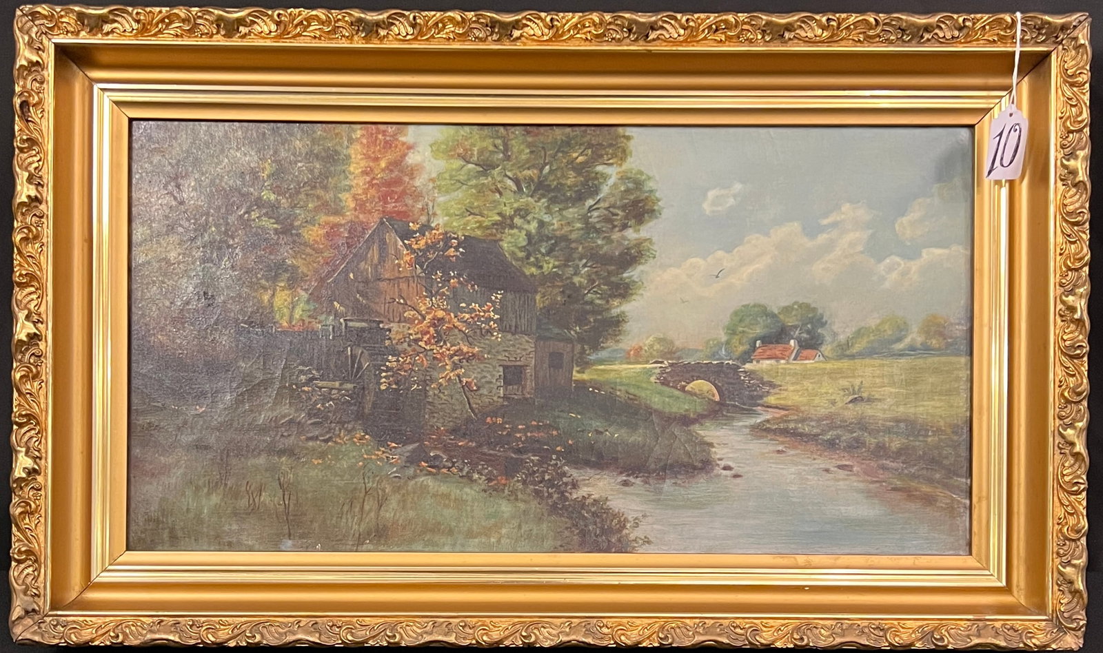 Oil on Canvas American Landscape: A well-executed American landscape depicting a bridge and stone mill with paddle wheel. Unsigned oil on canvas in original frame. In excellent condition, it measures 14.5" tall X 25" across.