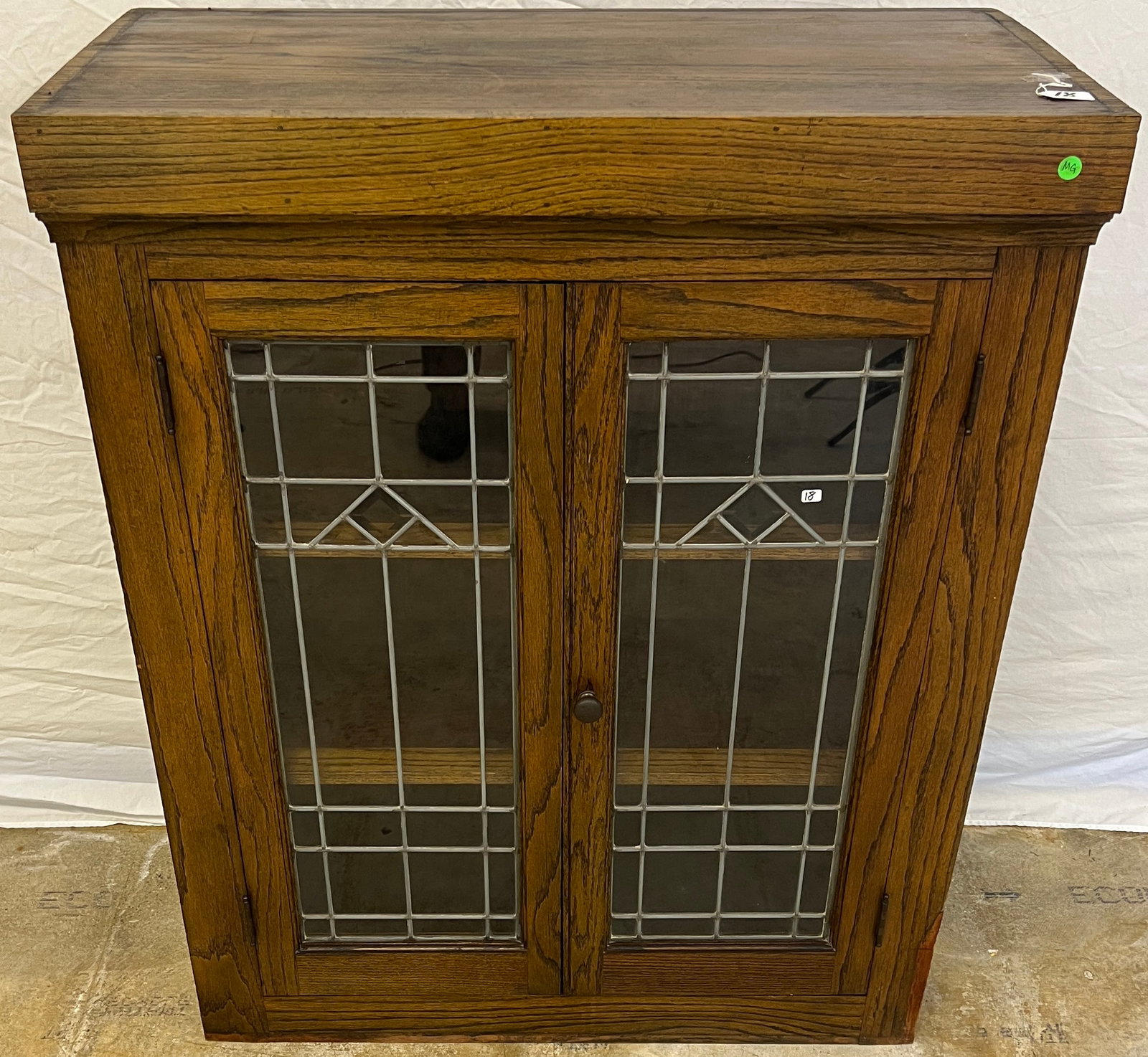 Arts & Crafts Beveled and Leaded Glass Double Door Bookcase: Architectural salvage. Arts and crafts mission style. Beveled and leaded glass, double doored, built in bookcase. Good original finish. Measures 45" tall by 35" across by 17" deep.