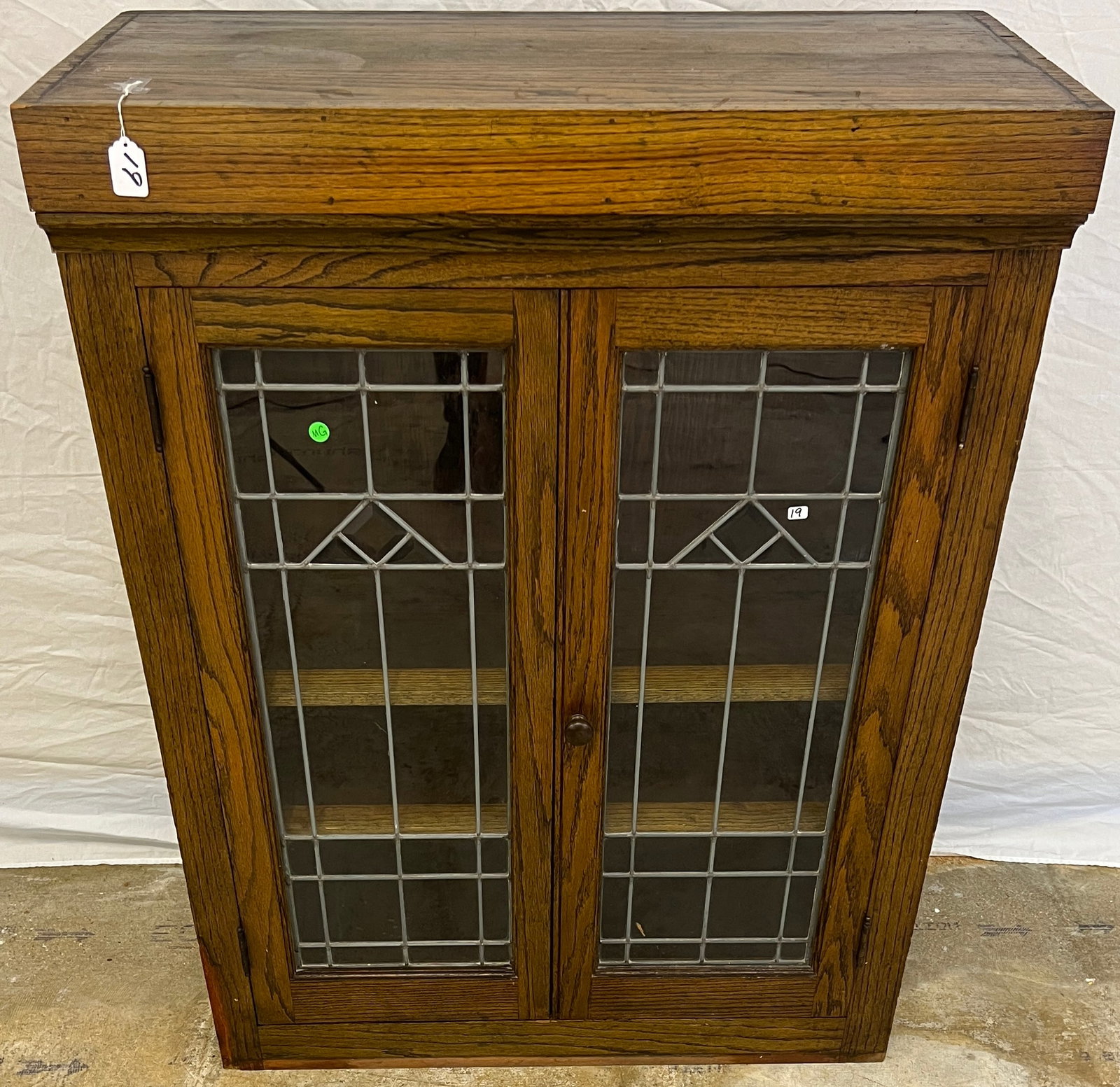 Arts & Crafts Beveled and Leaded Glass Double Door Bookcase: Architectural salvage. Arts and crafts mission style. Beveled and leaded glass, double doored, built in bookcase. Good original finish. Measures 45" tall by 35" across by 17" deep.