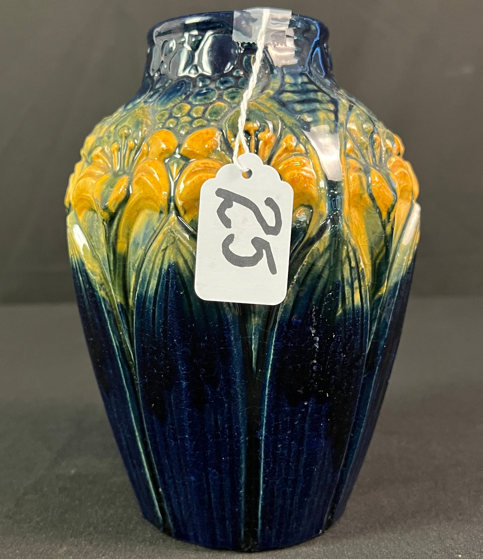 Brush McCoy Amaryllis Majolica Ware Vase: A Brush McCoy Amaryllis majolica ware vase in good condition. Piece has bright coloration and presents nicely, it measures 7.5" tall.