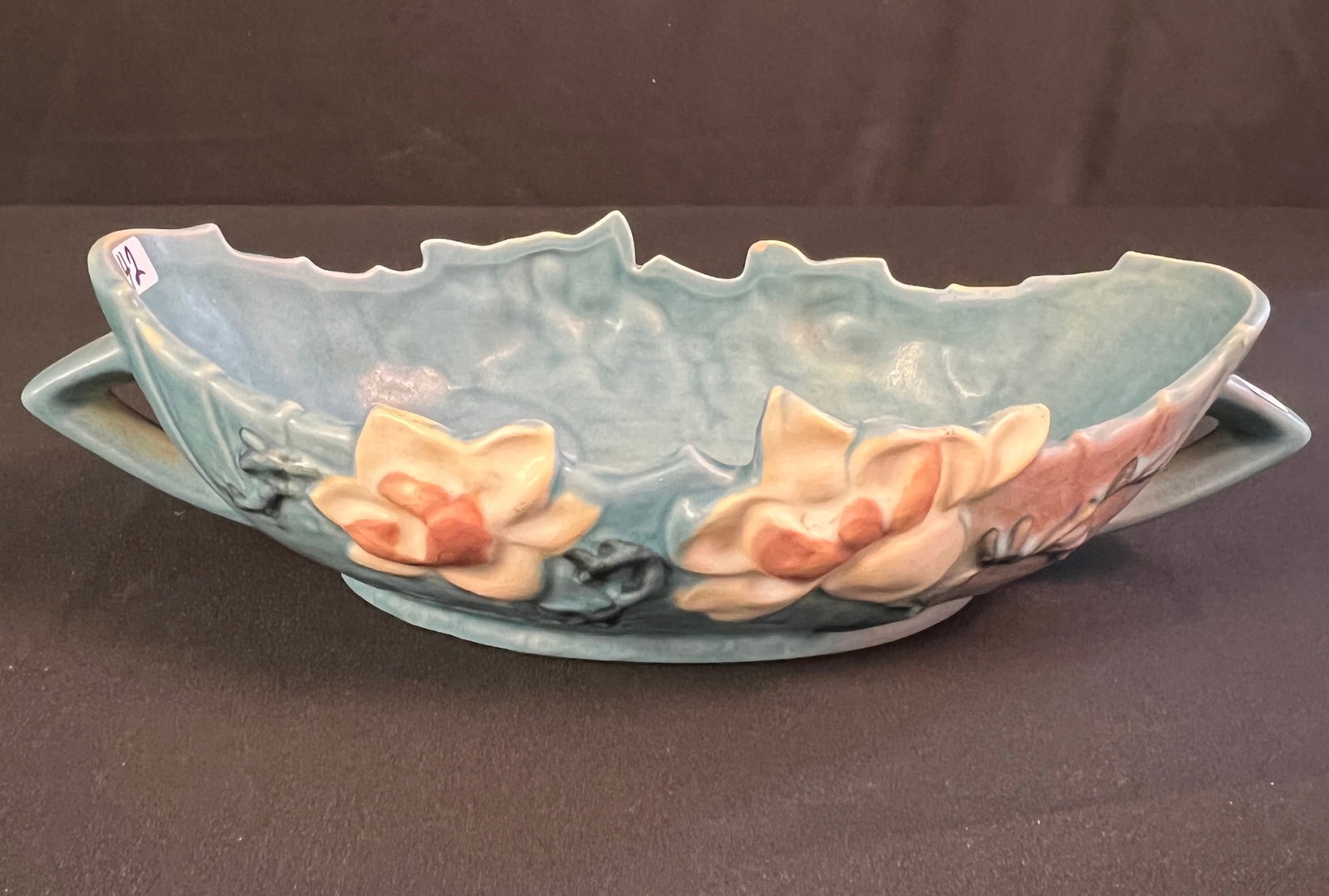 Roseville Magnolia Console Bowl: A Roseville "Magnolia" console bowl with double handles, it measures 3.5" tall X 14" across, in excellent condition.