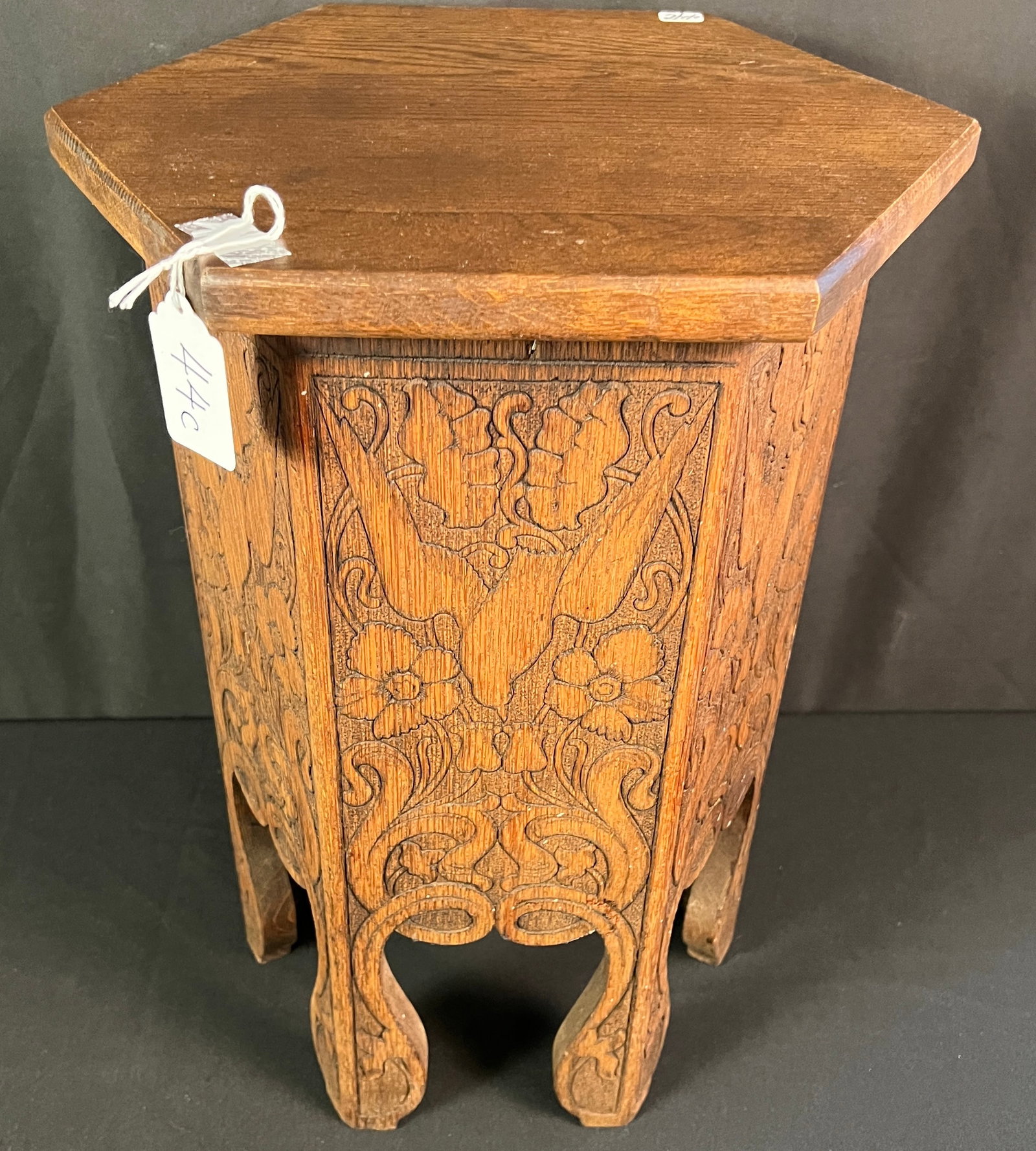 Arts and Crafts Press-Carved Octagon Table: A quality Arts & Crafts octagon side table with elaborate press-carved decorations in a Moorish style, with birds and flowers in its details. In excellent condition, it measures 19" tall X 12" around.