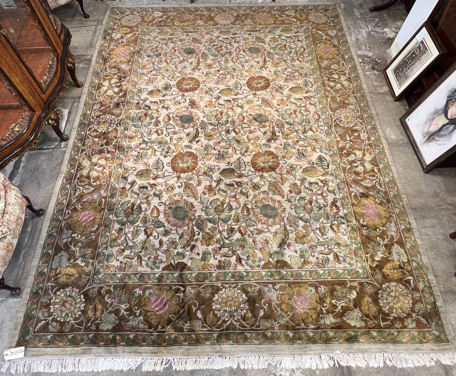Custom Persian Room Sized Rug: This custom Persian room sized rug features a full field floral, contains 4 borders and retains its original fringe. It is done in creams, greens, burgundies and browns. It measures 146" X 108".