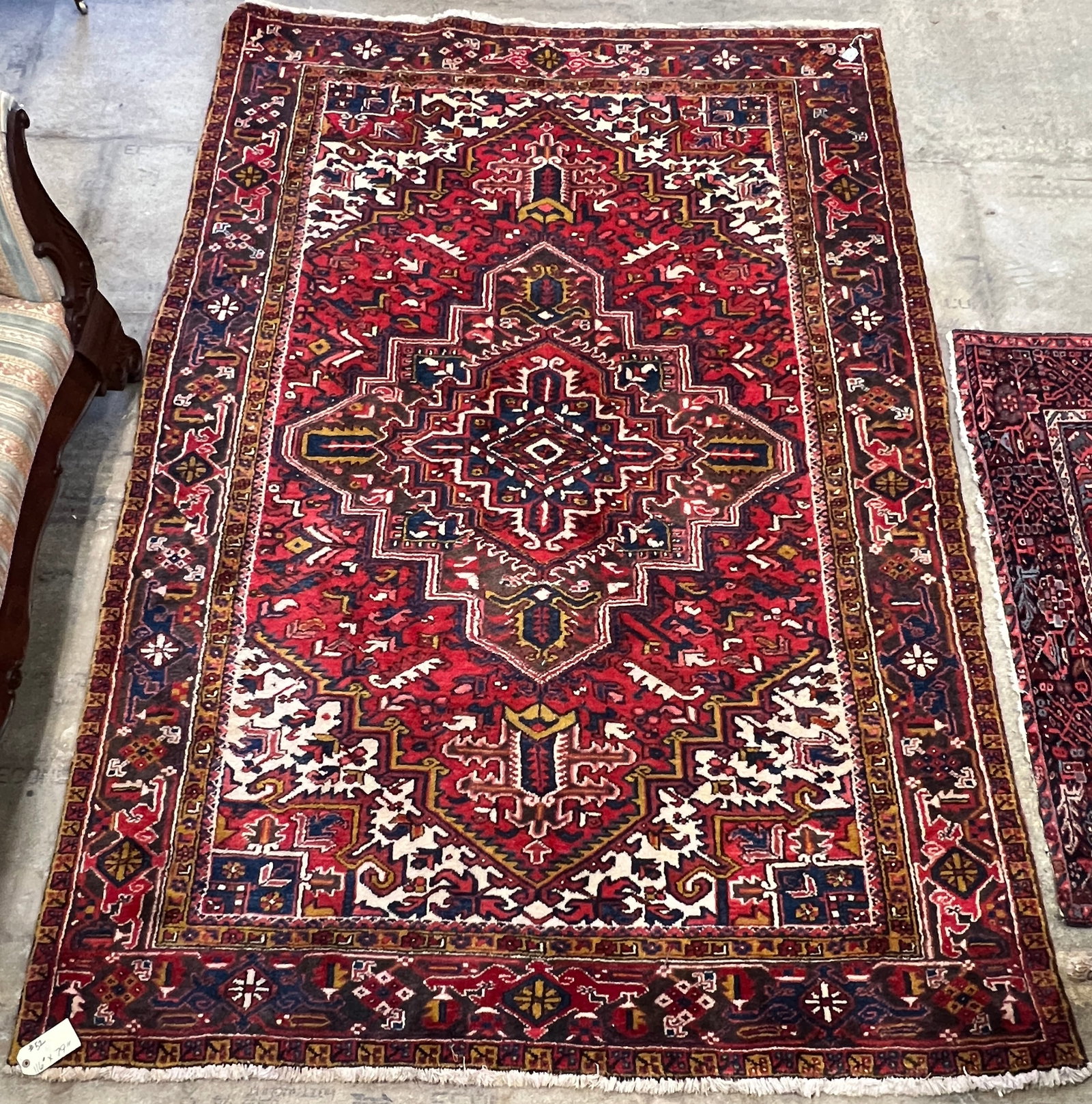 Antique Large Vibrant Persian Rug: A large antique Persian rug in vibrant colors to include burgundy, blue, cream and brown. This large rug has a 4 border edging and is in excellent condition, retains thick pile. Rug has an elaborate g