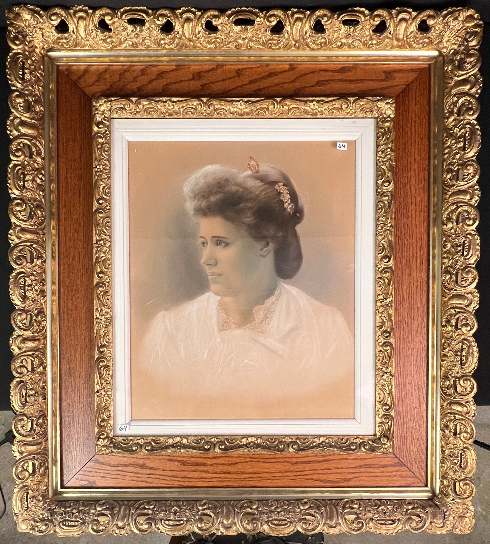 Stunning Victorian Frame with Portrait of Woman: A stunning elaborate gold leaf gesso and oak frame with a Victorian portrait of a young beauty done in pencil and charcoal. It measures 38" tall X 34" across.