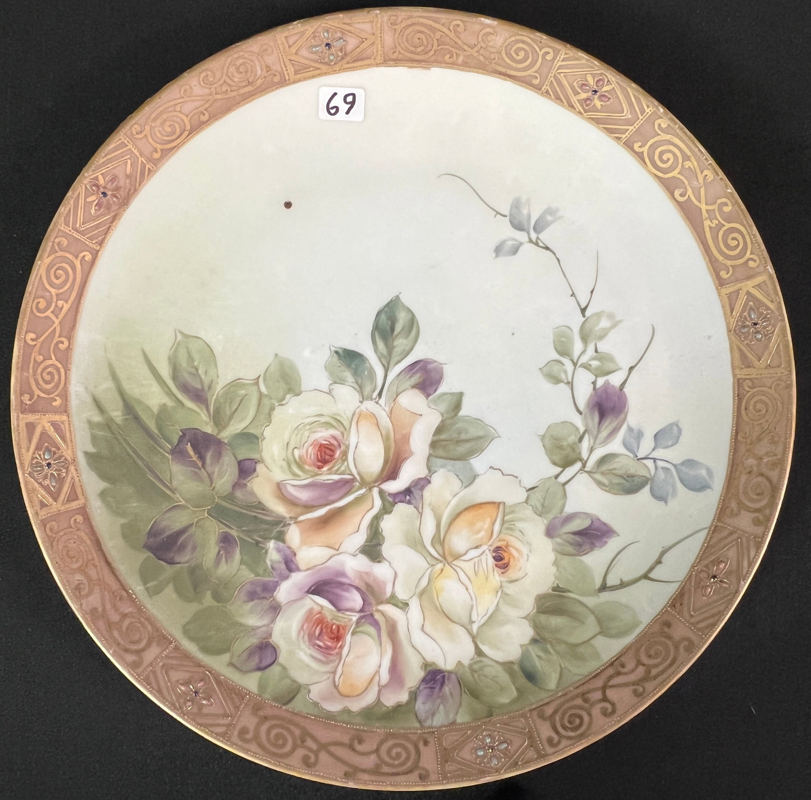 Nippon Floral Wall Charger: A hand painted Nippon wall charger with blue leaf marks, heavily beaded scroll, and hand painted rose interior. This large hand painted charger measures 12" round