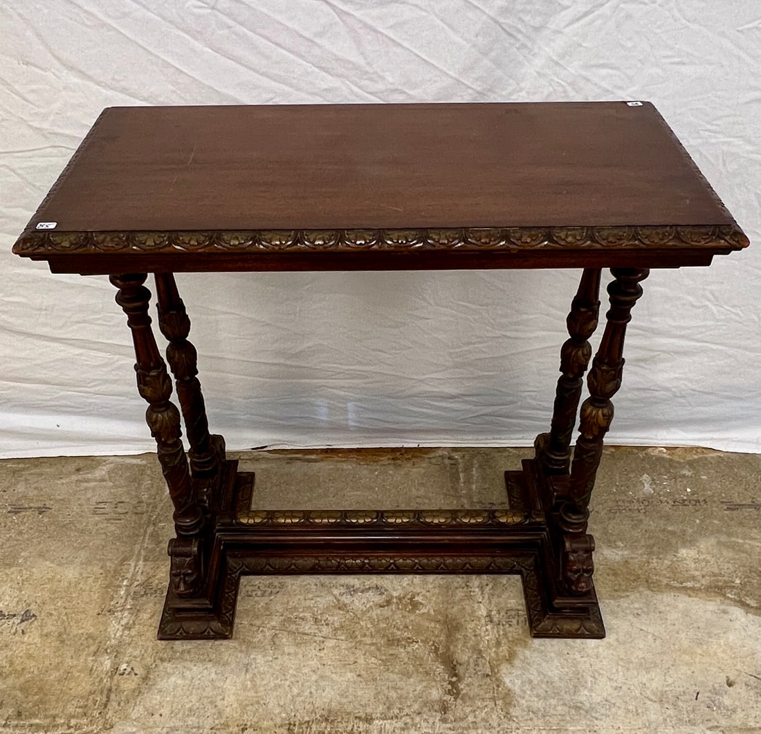 Mahogany Lion's Head Table C.1900: A mahogany side table with carved lion's heads, acanthus carved floral barley twist posts and egg and dart trim. This turn of the century end table is in original finish and measures 28" tall X 30"