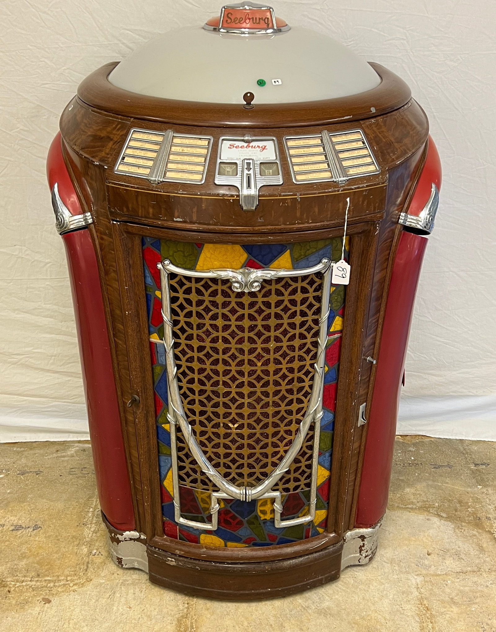 Seeburg Symphonia 147 Jukebox (Trash Can) c.1947: A Seeburg Symphonia 147 Jukebox (Trash Can), c. 1947 with many vintage 1950/60's 45 records still in it. It is unworking and has damage to the celluloid. In as is condition.