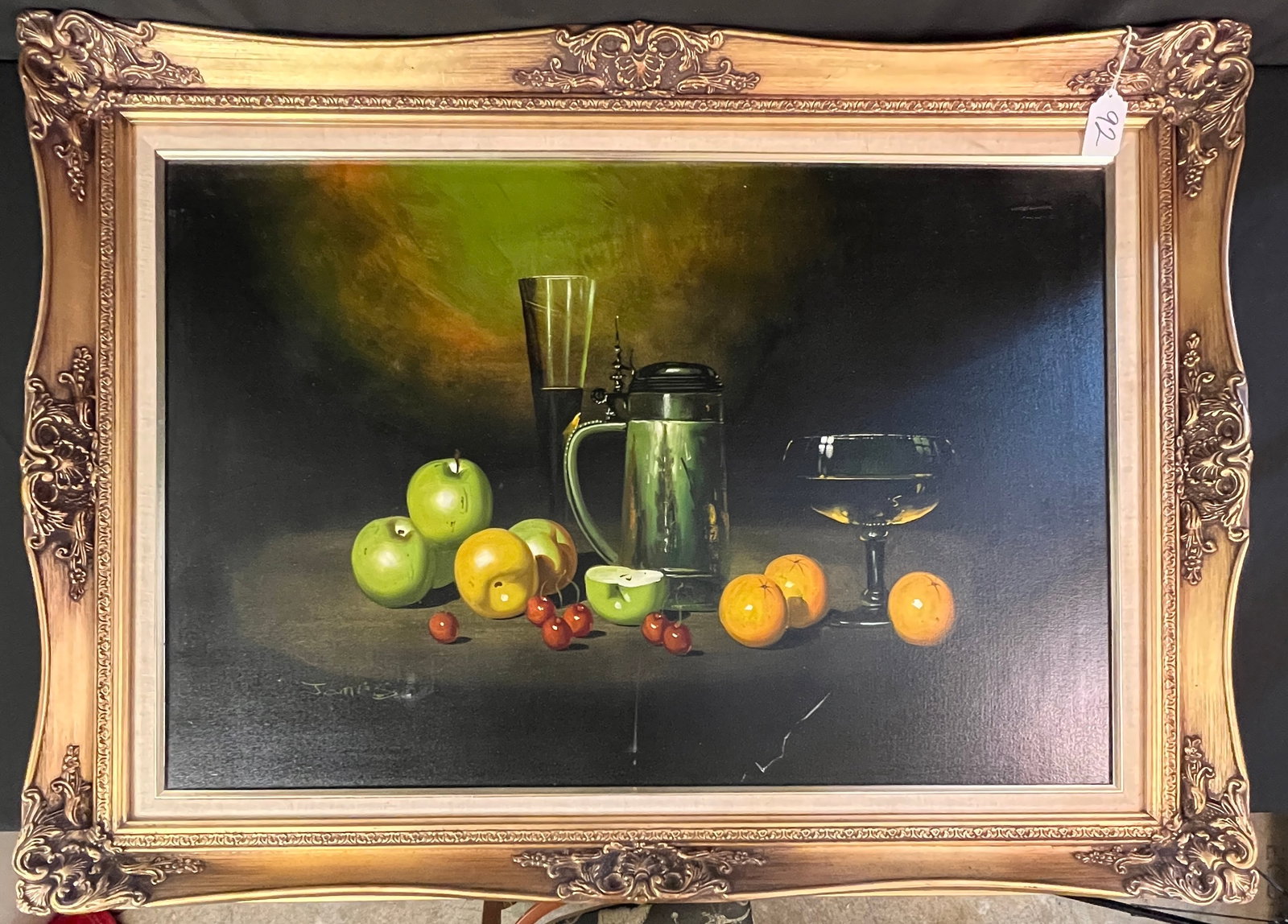 Large Oil on Canvas Still Life, Signed James c.1970's: A quality framed still life signed James C.1970's depicting fruit, glasses of wine , and a pitcher on a dark background. It is signed in the lower left corner and in very good condition. It measures