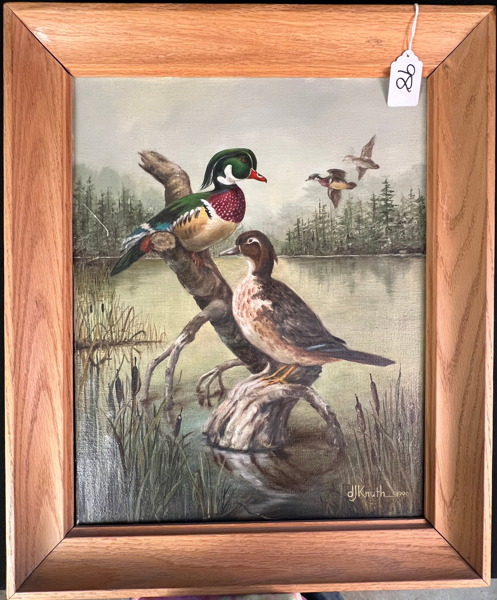 DJ Knuth Oil on Canvas Duck Painting c.1990: A quality framed oil on canvas c.1990, signed D J Knuth that depicts ducks on a pond, It is signed in the lower right corner. It measures 24" tall X 19.5" across.