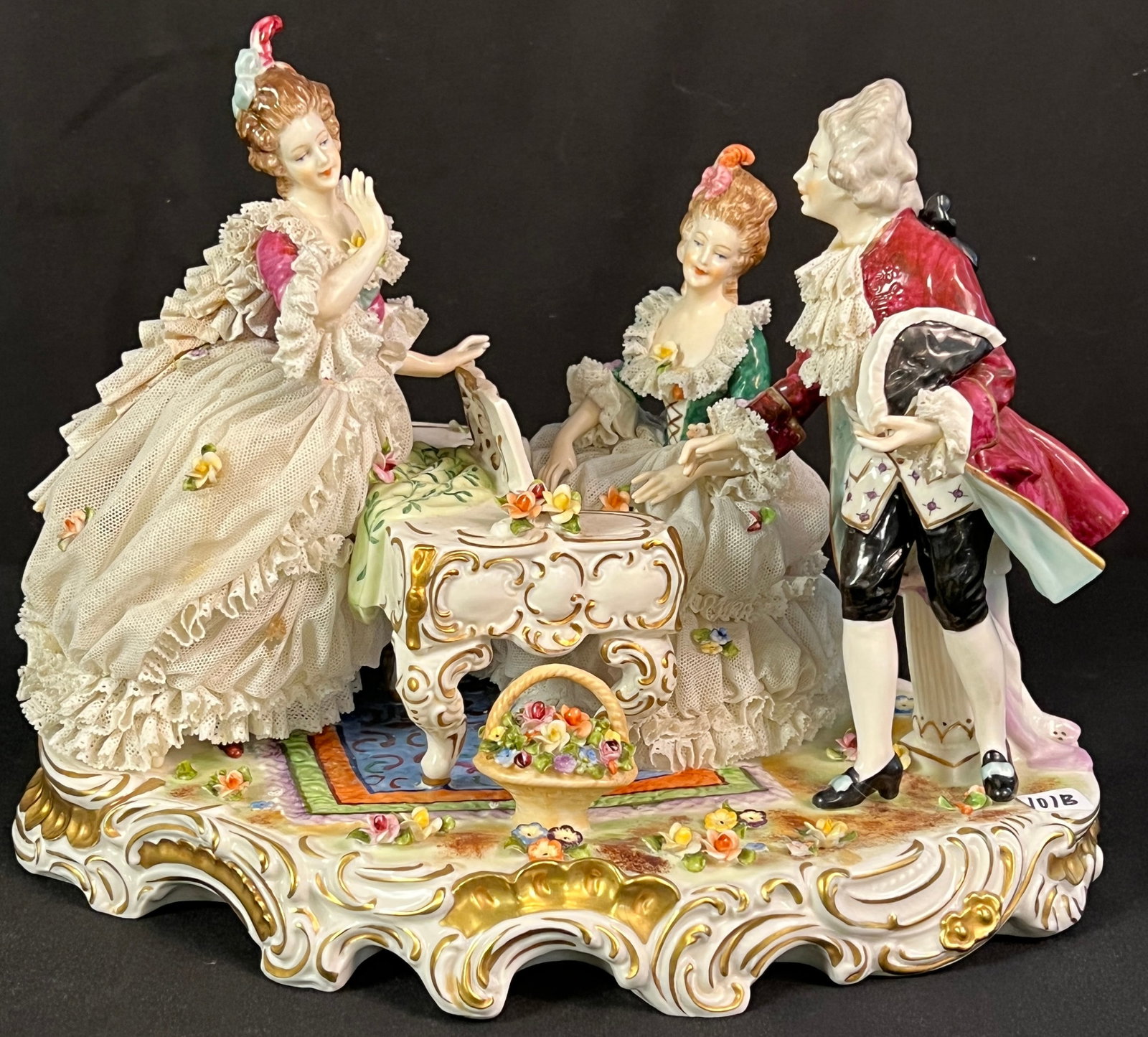 HS Unterweissbach Porcelain Figurine, c.1940s: HS Unterweissbach porcelain figurine, c. 1940s. An HS Unterweissbach German Dresden style German porcelain figurine depicting a 19th century courtly scene of a woman at a small piano, with another wom