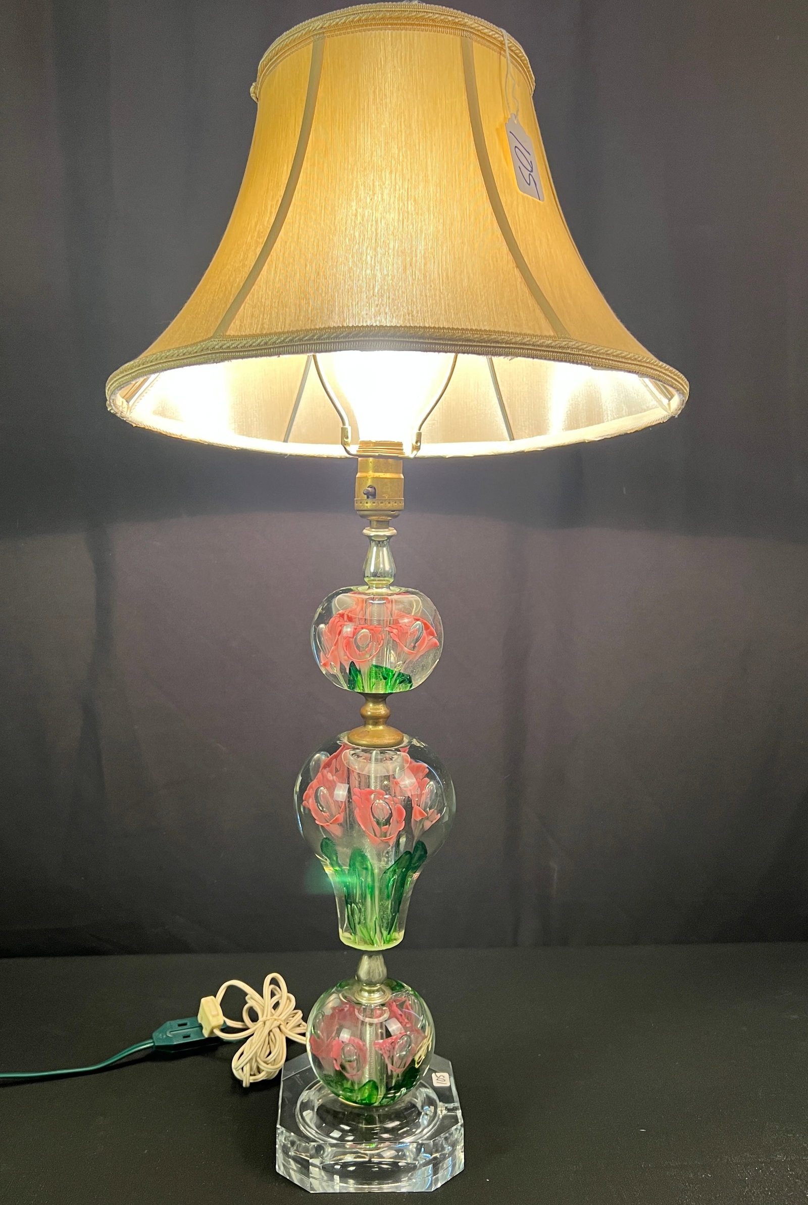 St, Clair Control Floral Bubble Paperweight Lamp c.1950's: A 1950's St. Clair floral control bubble paperweight lamp c.1950's in excellent condition that features pink petals and green leaves. It measures 32" tall X 6" across.