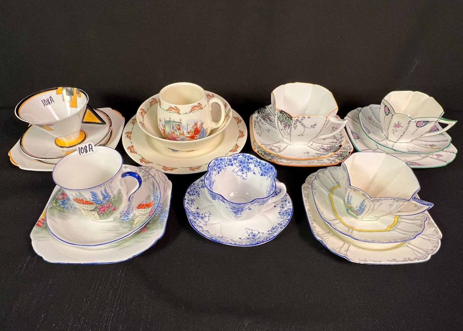 Shelley Cups, Saucers and Dessert Plate Sets and More: 5 Shelley cups, saucers, and dessert plates, along with and English bunnykins breakfast set of a cup, bowl and plate, and a blue and white Shelley cup and saucer. All in great condition.