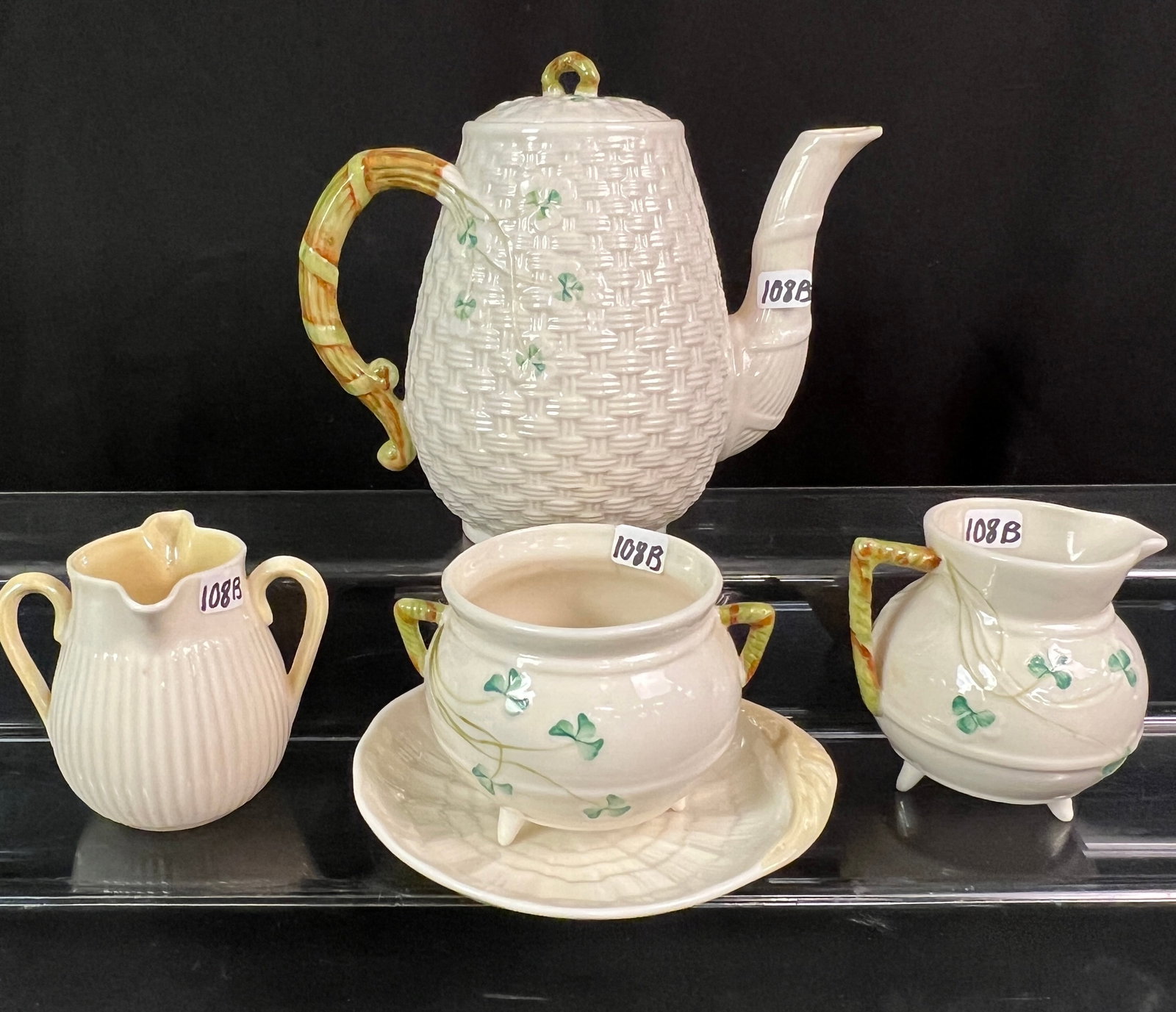 Group of Belleek Porcelain: A group of Belleek porcelain to include teapot, creamers, candy dish and more. All in great condition.
