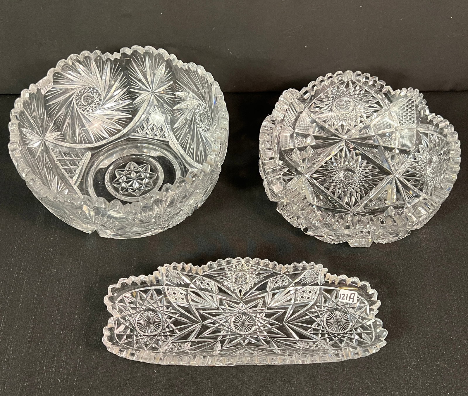Group of Brilliant Cut Crystal: A group of brilliant cut crystal to include a huge pinwheel cut bowl (5.25" tall X 9" round), a Victorian profusely cut bowl (3" tall X 9" round), a Victorian profusely cut relish dish (11" long X 4.5