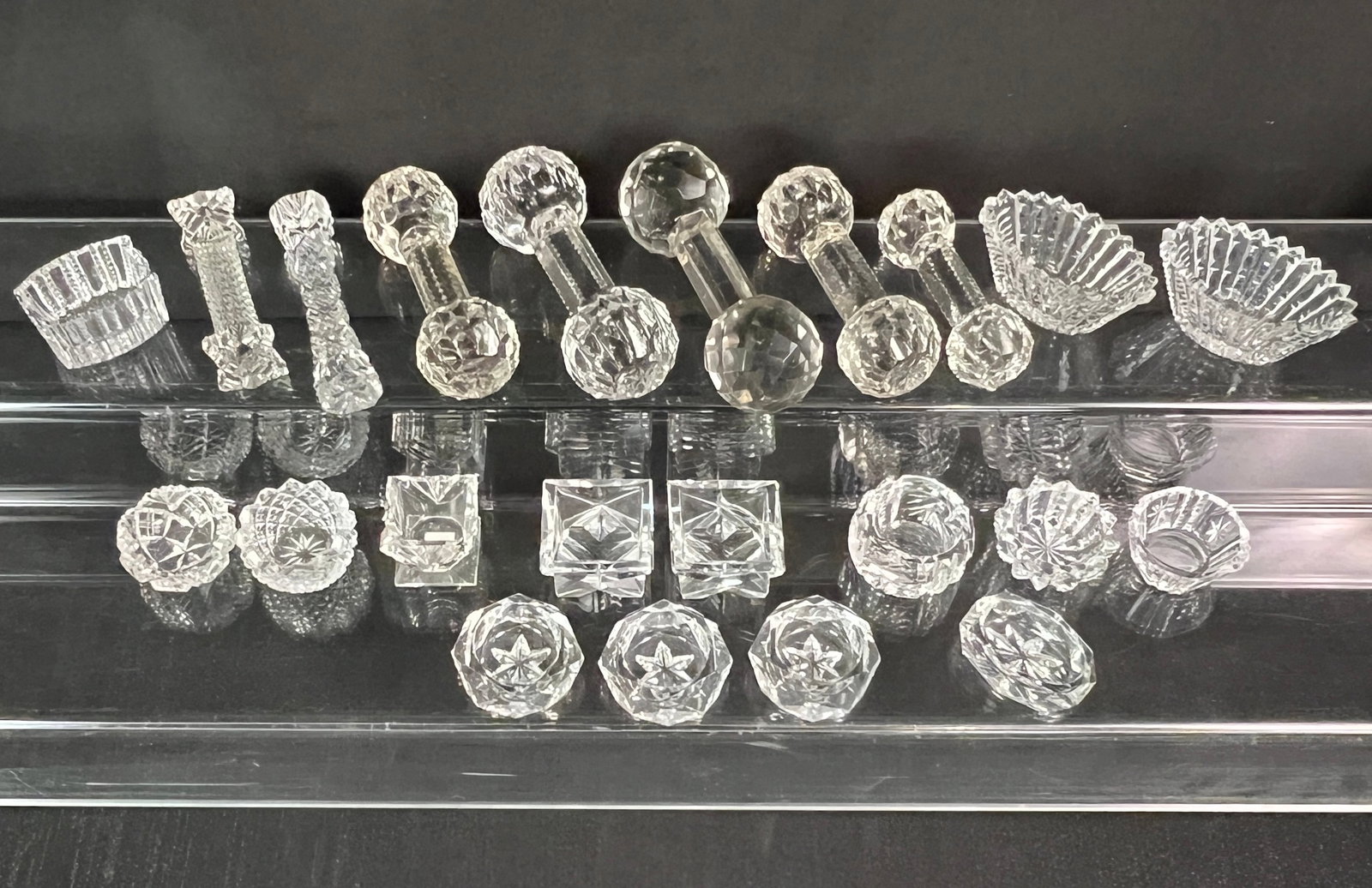 Large Group of Cut Crystal Salt Dips & Knife Rests: A large group of fun and varied 15 cut crystal salt dips and 7 cut crystal knife rests. All in good condition and fun variety.