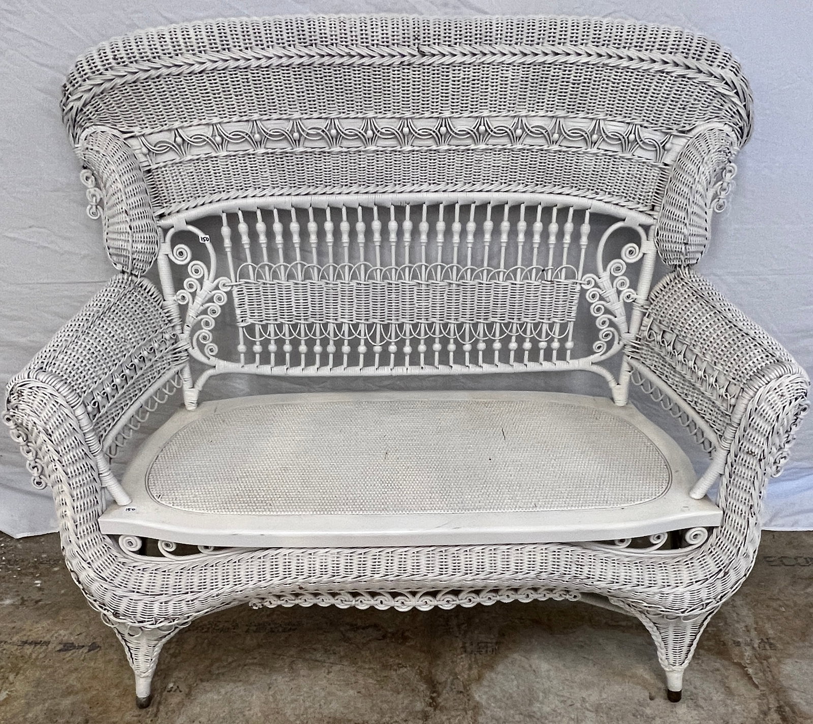 Victorian Heywood Wakefield Stick and Ball Bench: A rare Victorian Heywood Wakefield Stick and Ball wicker loveseat with serpentine frame, curly cues, and decorative weave work in excellent condition. Victorian wicker pieces of this caliber are incre